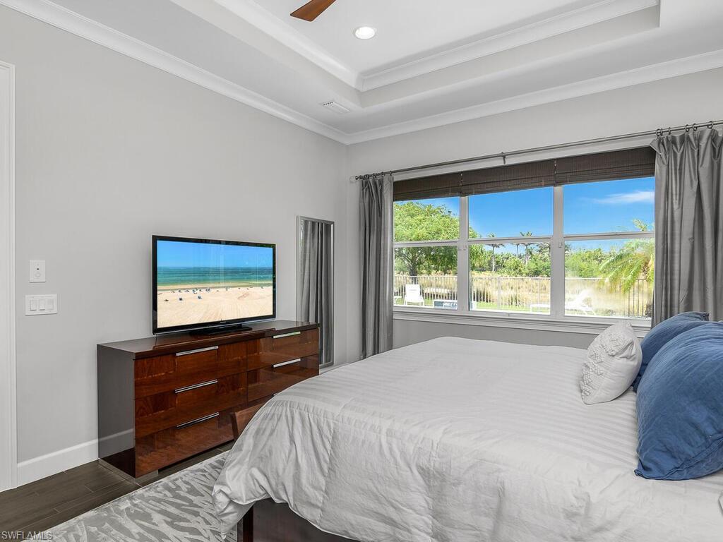6478 Warwick Avenue Naples, FL 34113 - Photo 34 of 47 a bed room with a bed and a television