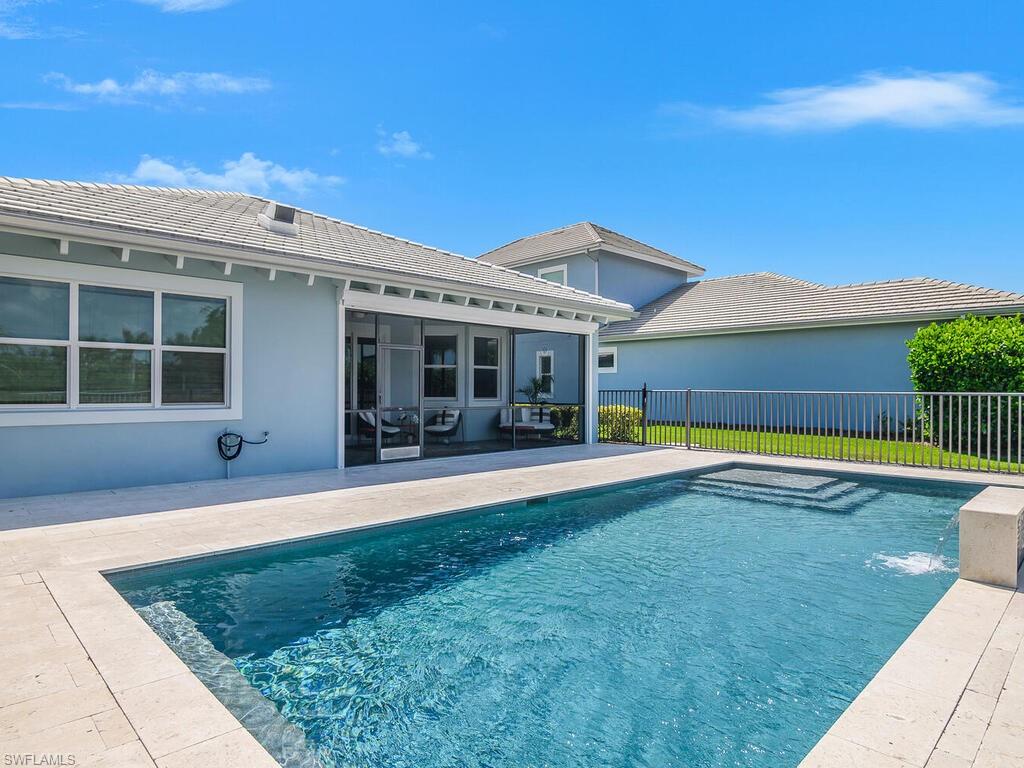 6478 Warwick Avenue Naples, FL 34113 - Photo 36 of 47 a view of a house with a swimming pool and sitting area