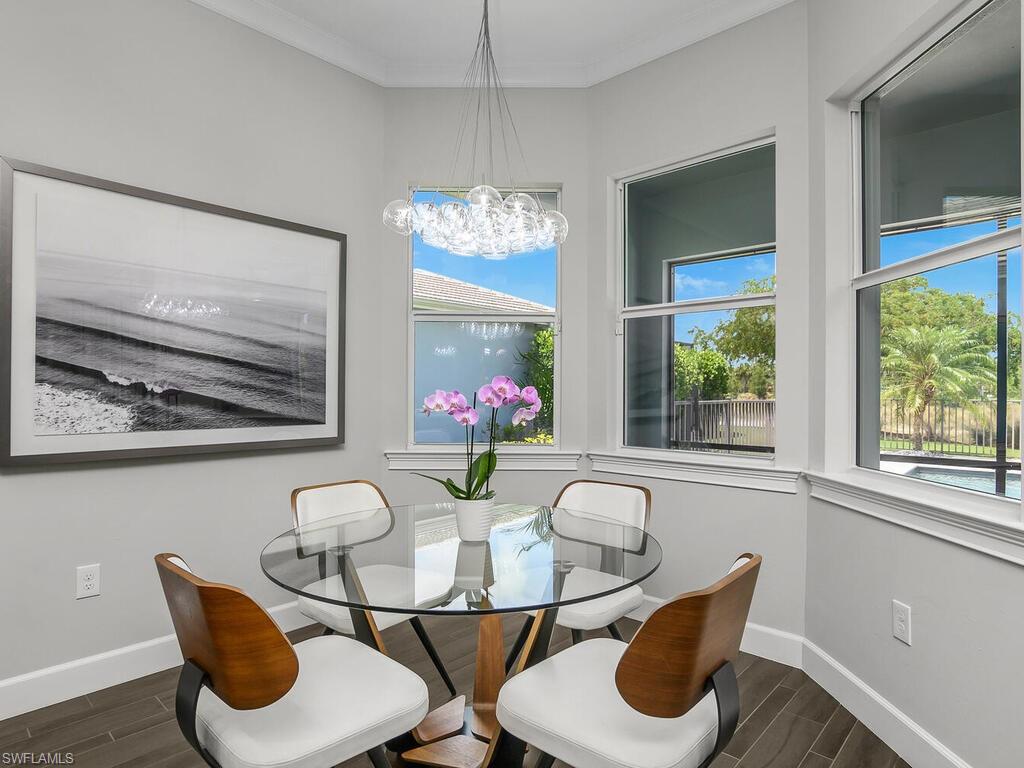6478 Warwick Avenue Naples, FL 34113 - Photo 8 of 47 a view of a dining room with furniture window and outside view