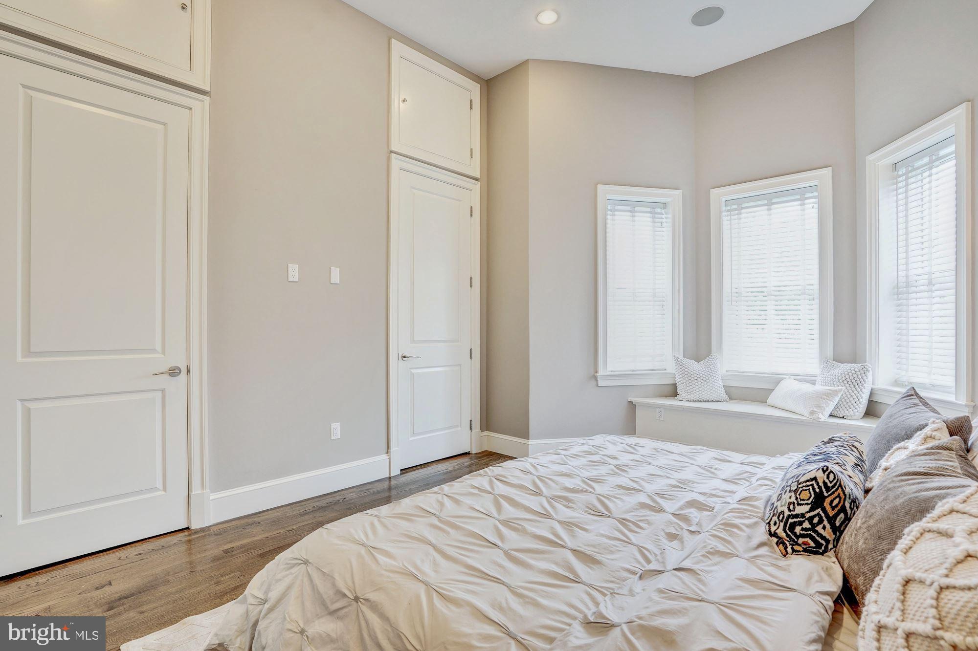 1333 East Capitol Street Southeast Washington, DC 20003 - Photo 19 of 43 Bay window and wall of closets in master bedroom