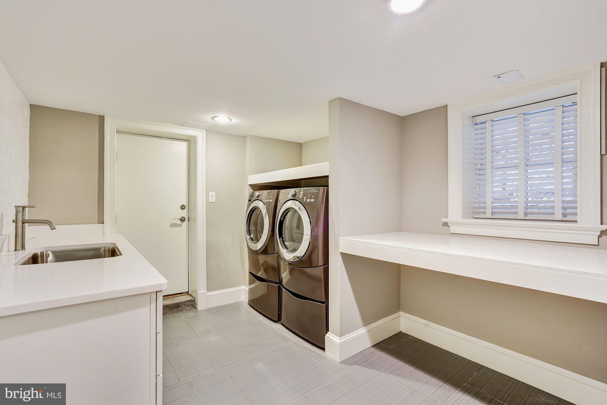 1333 East Capitol Street Southeast Washington, DC 20003 - Photo 35 of 43 Laundry room with sink and folding table