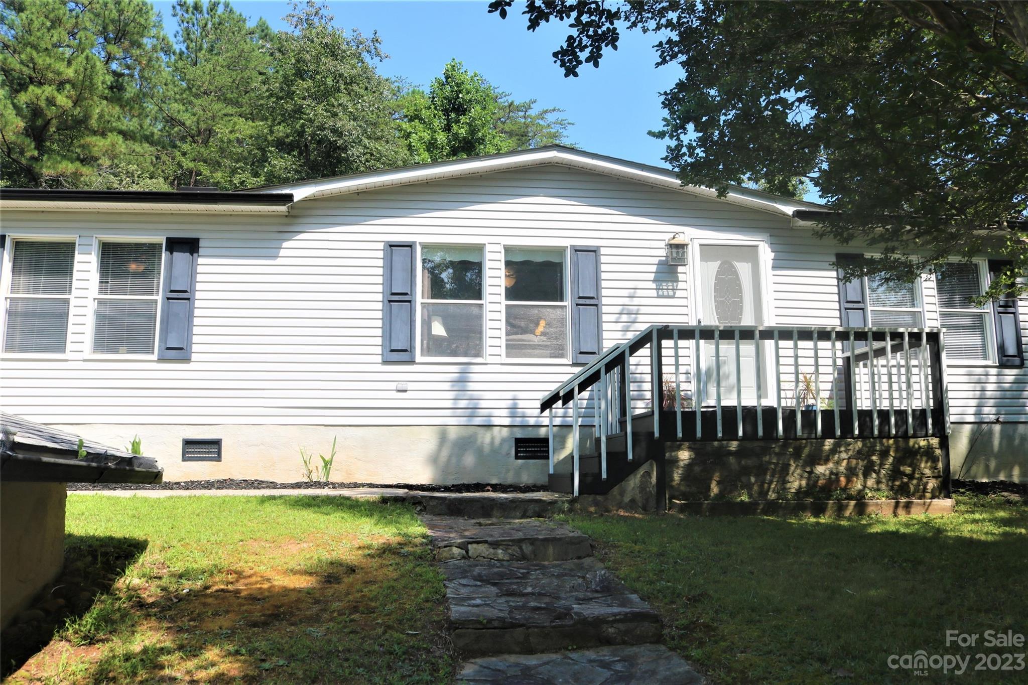 2919 Grassy Knob Road Mill Spring, NC 28756 - Photo 1 of 29 a front view of a house with yard
