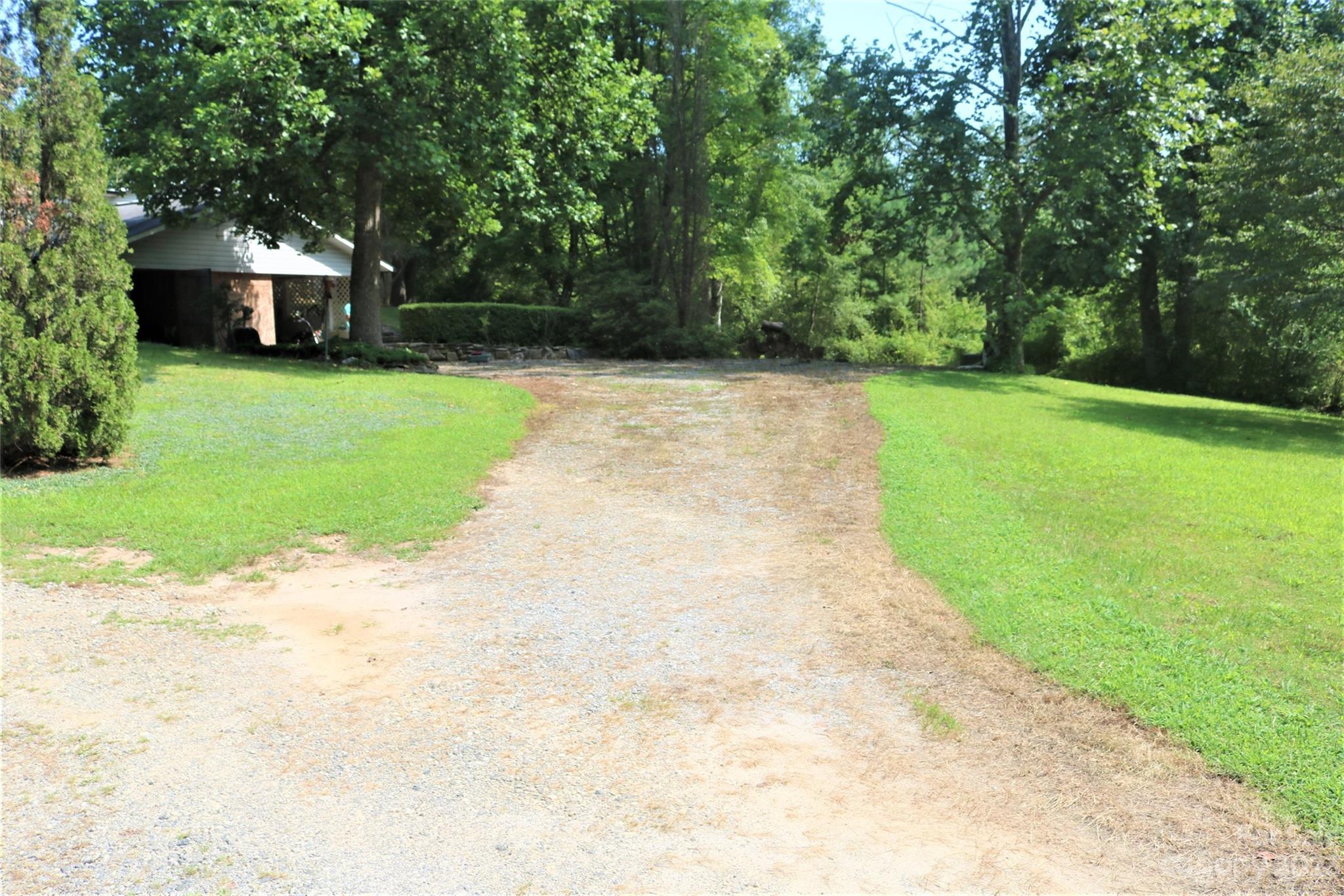 2919 Grassy Knob Road Mill Spring, NC 28756 - Photo 16 of 29 a view of a backyard with large trees