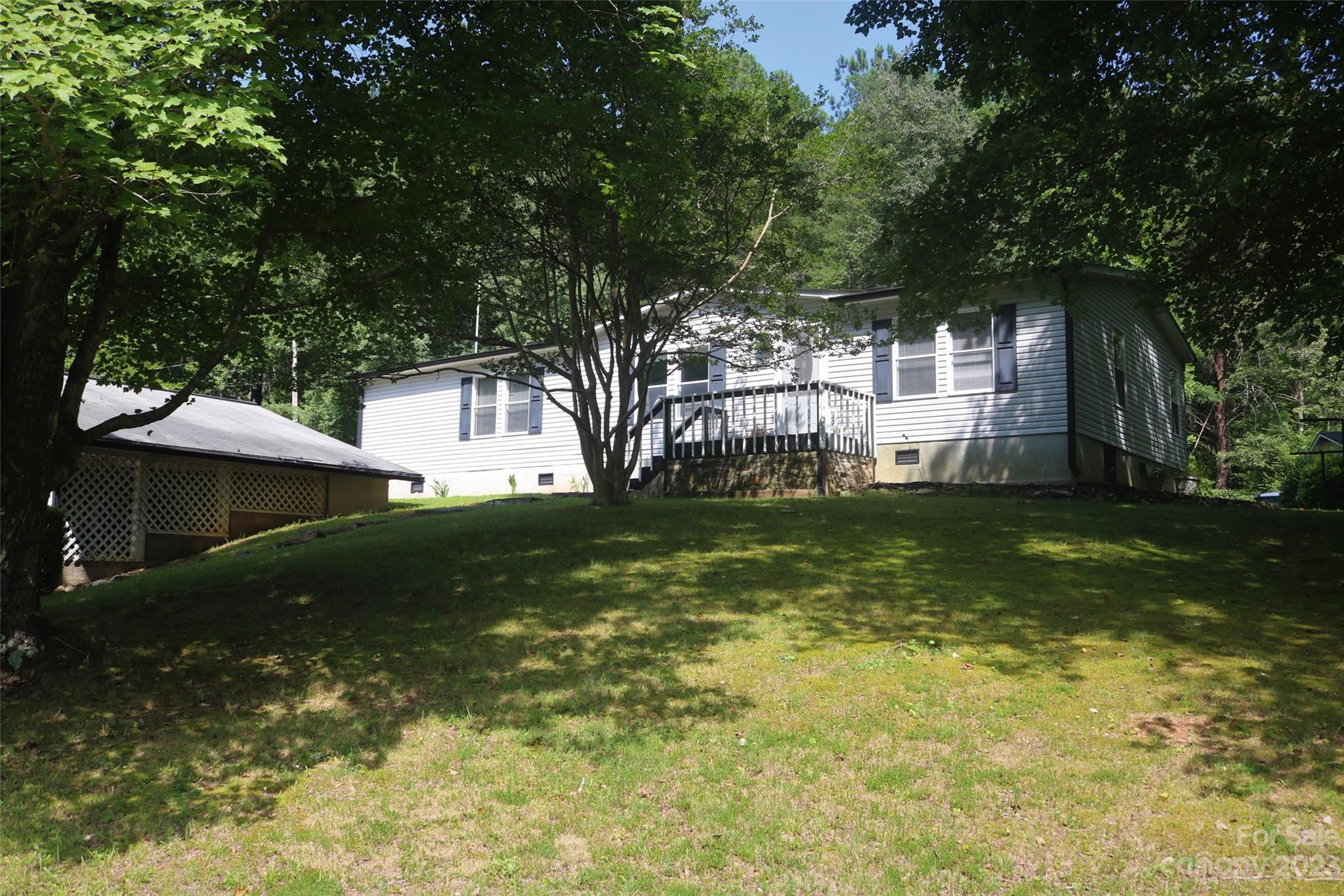 2919 Grassy Knob Road Mill Spring, NC 28756 - Photo 2 of 29 a view of a house with a yard