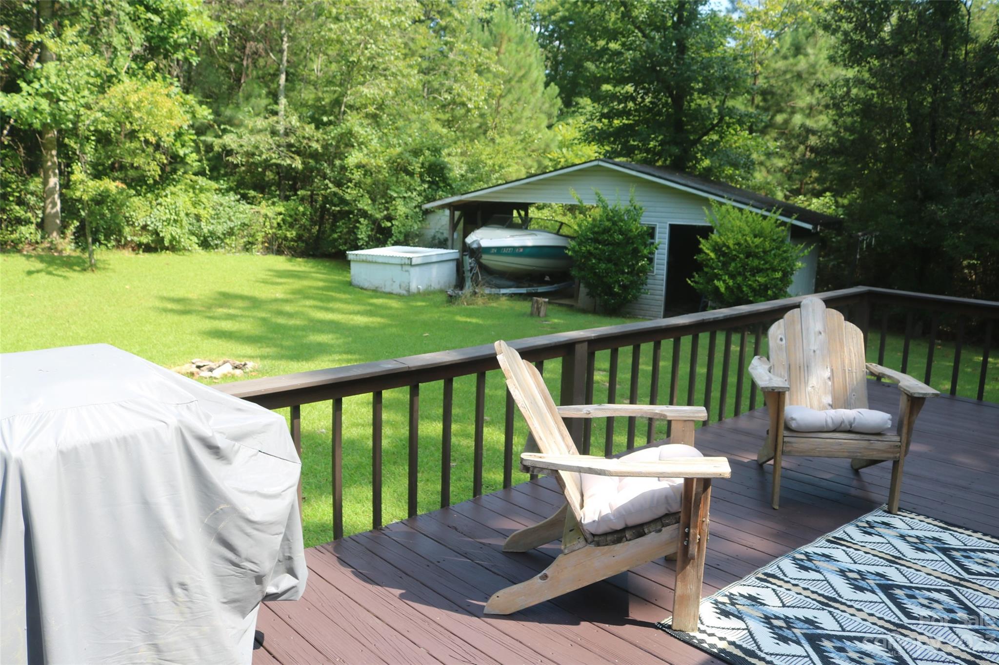 2919 Grassy Knob Road Mill Spring, NC 28756 - Photo 21 of 29 a balcony with wooden floor table and chairs