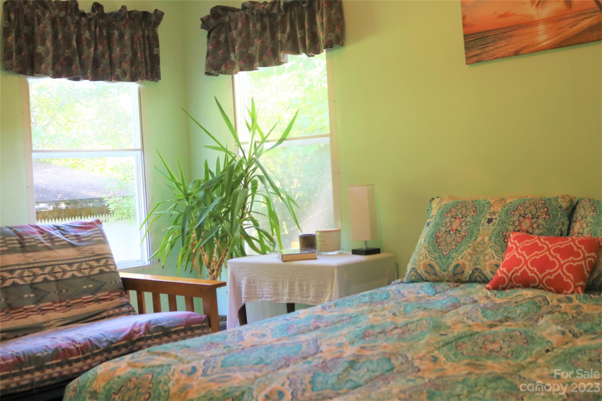 2919 Grassy Knob Road Mill Spring, NC 28756 - Photo 5 of 29 a bedroom with a bed and a window