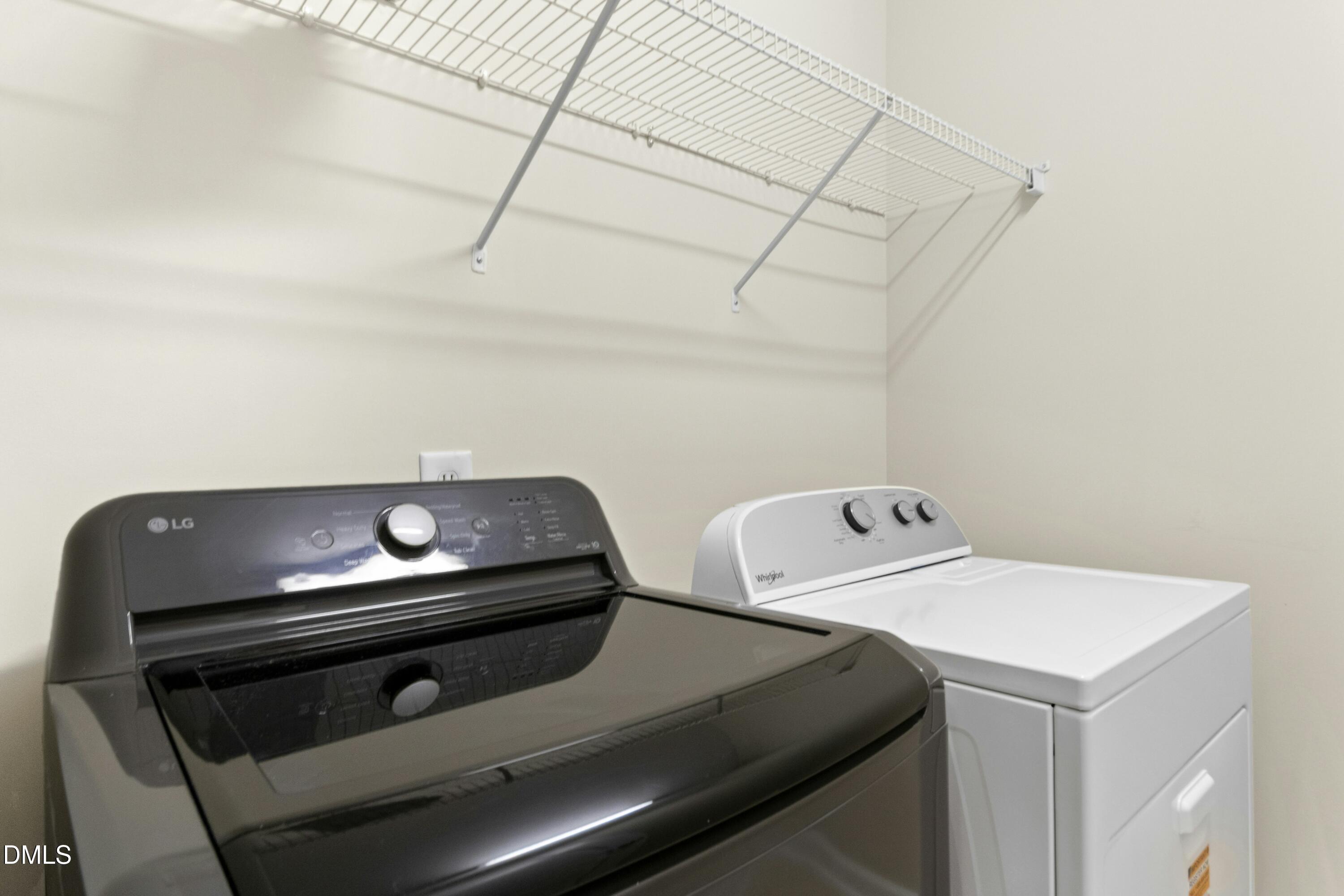 5541 Nur Lane Raleigh, NC 27606 - Photo 30 of 33 a utility room with dryer and washer