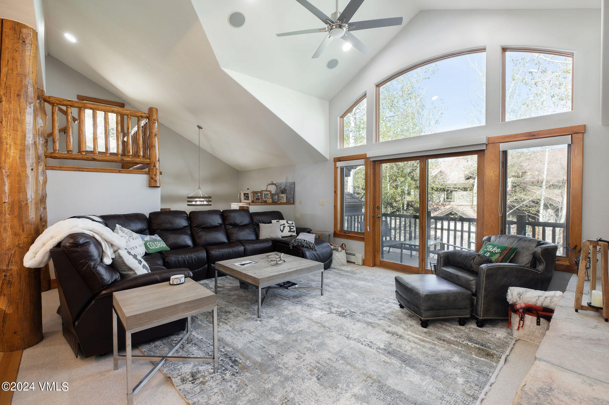 76 Knudson Ranch Road Edwards, CO 81632 - Photo 1 of 25 a living room with furniture and a large window