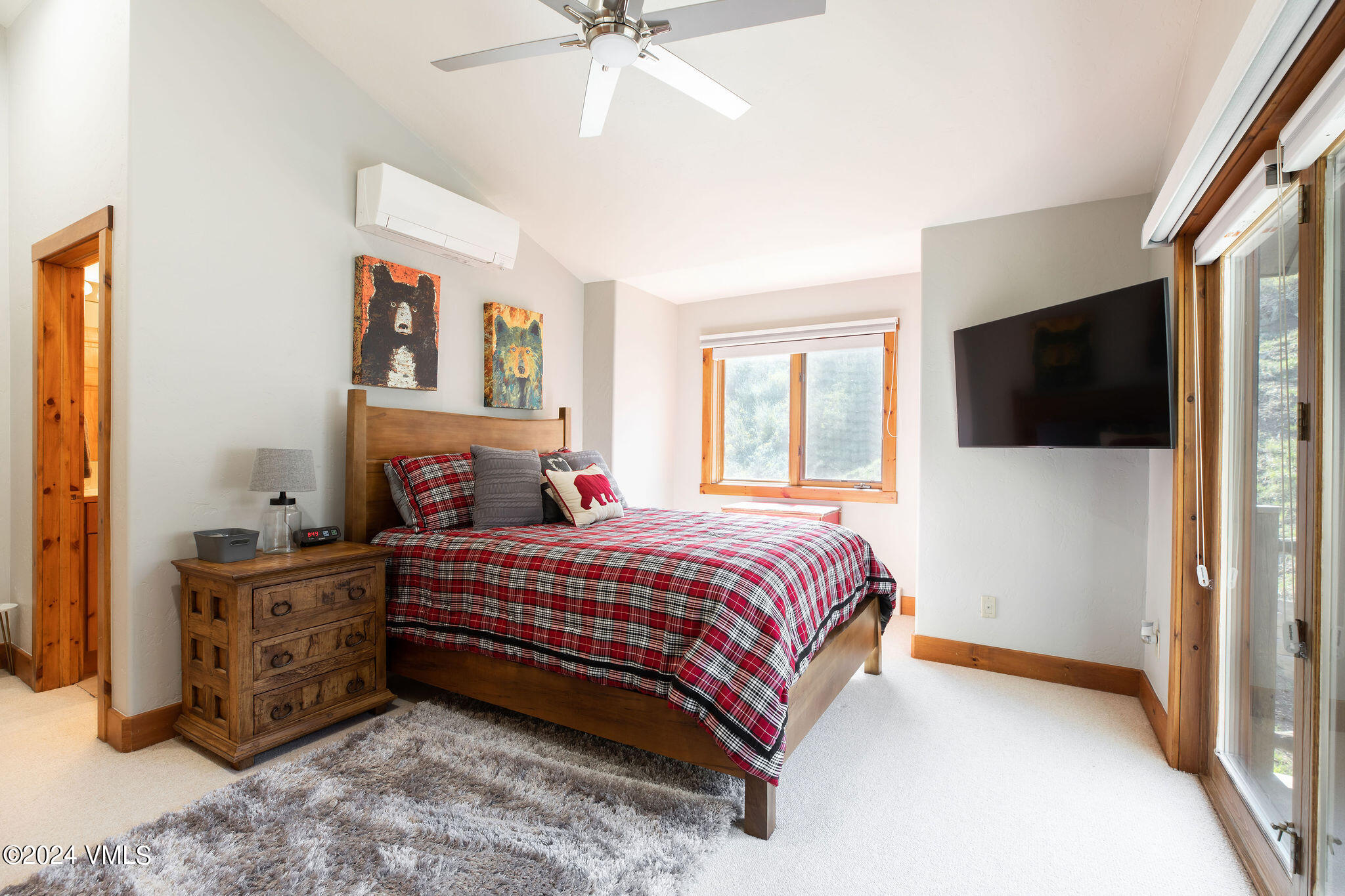 76 Knudson Ranch Road Edwards, CO 81632 - Photo 12 of 25 a bedroom with a bed and a flat screen tv