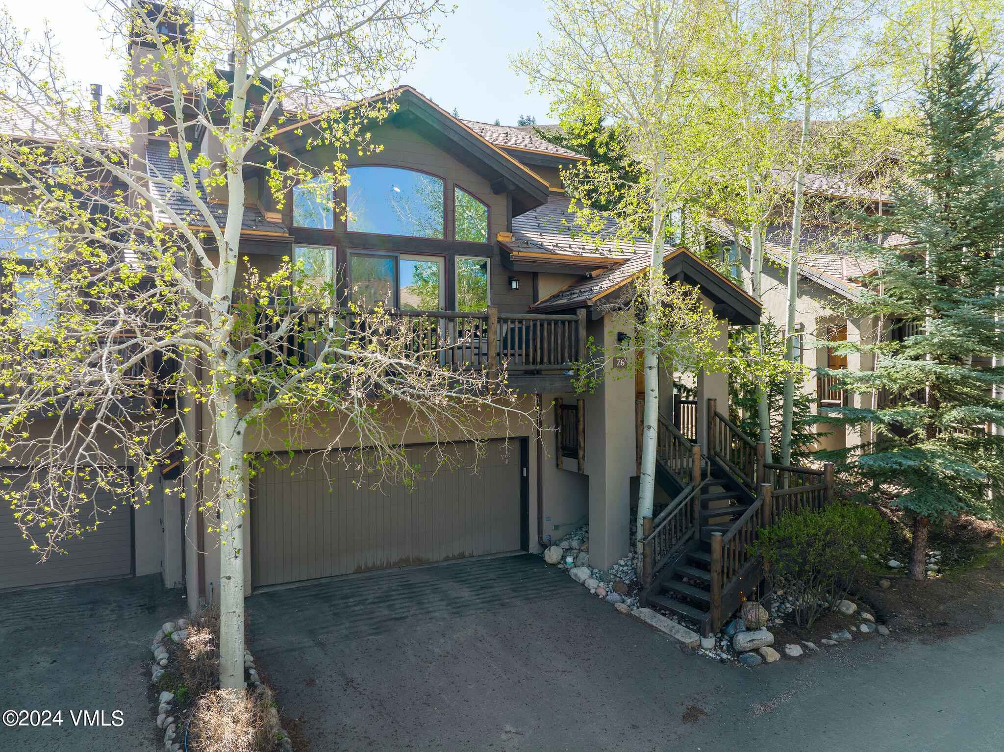 76 Knudson Ranch Road Edwards, CO 81632 - Photo 17 of 25 a front view of a house with a yard