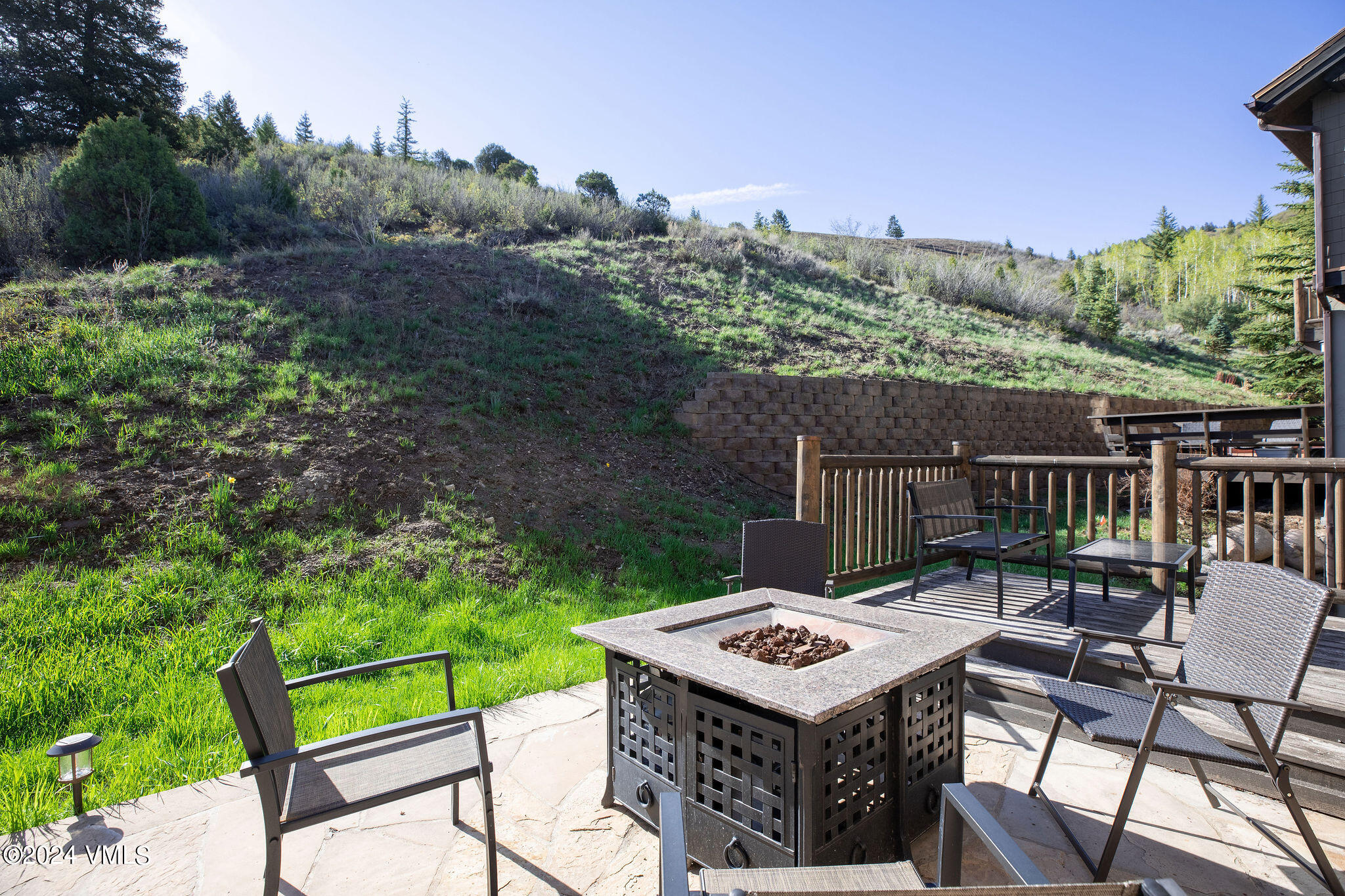 76 Knudson Ranch Road Edwards, CO 81632 - Photo 6 of 25 a view of a patio with a table and chairs