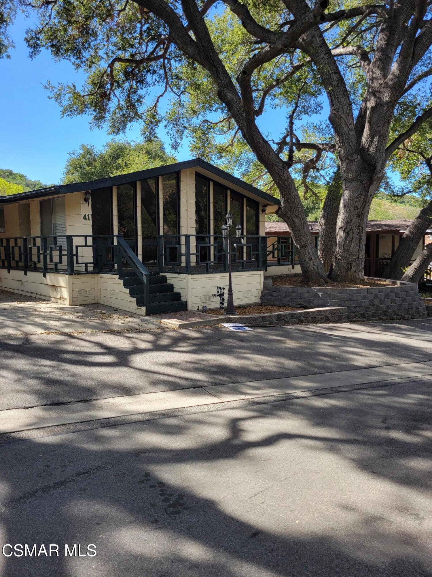 41 Old Castle Road Westlake Village, CA 91361 - Photo 1 of 13 a view of a house with a yard