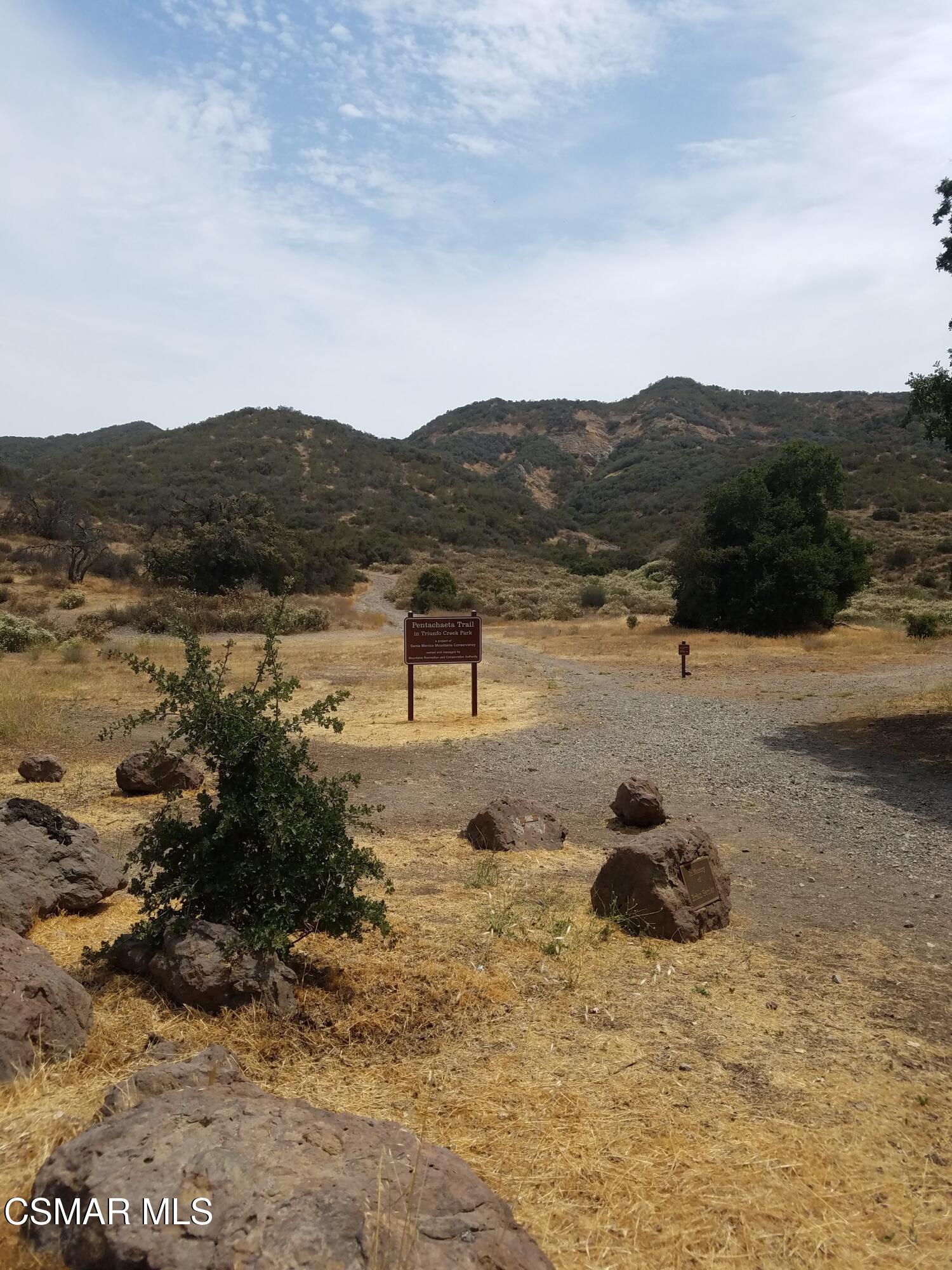41 Old Castle Road Westlake Village, CA 91361 - Photo 11 of 13 a view of a lake with mountain in front of it