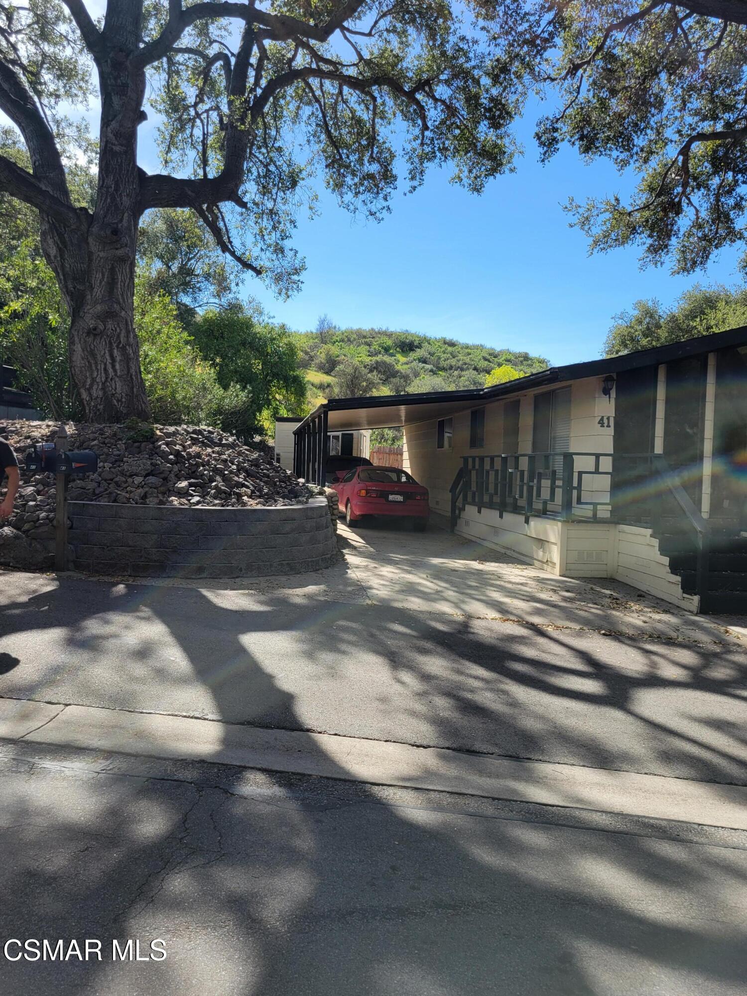 41 Old Castle Road Westlake Village, CA 91361 - Photo 2 of 13 a front view of a house with a yard