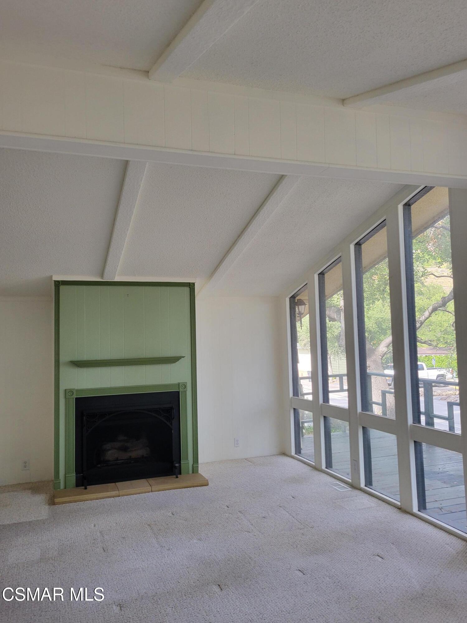 41 Old Castle Road Westlake Village, CA 91361 - Photo 3 of 13 a view of an empty room with a fireplace