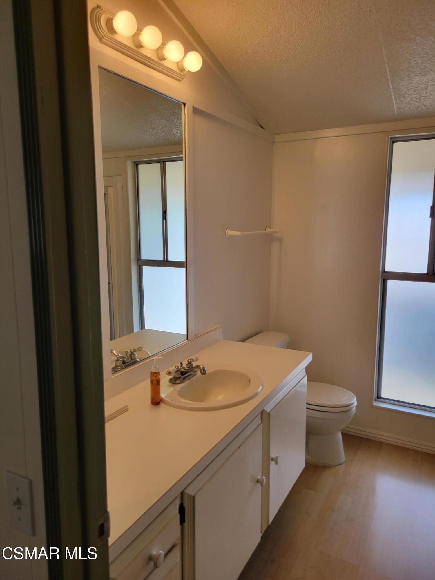 41 Old Castle Road Westlake Village, CA 91361 - Photo 8 of 13 a bathroom with a sink a toilet and a mirror