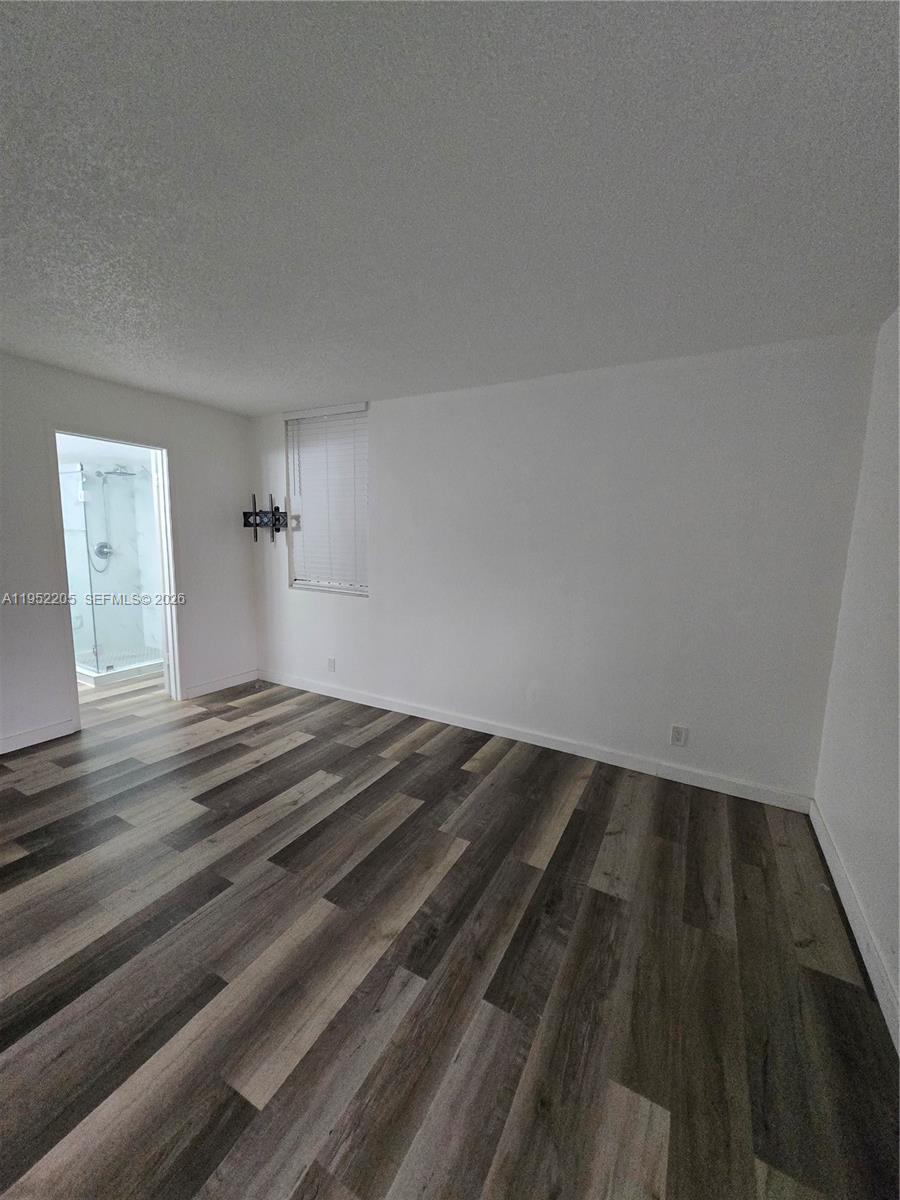 12219 Southwest 14th Lane, Unit 2110 Miami, FL 33184 - Photo 62 of 76 a view of empty room with wooden floor