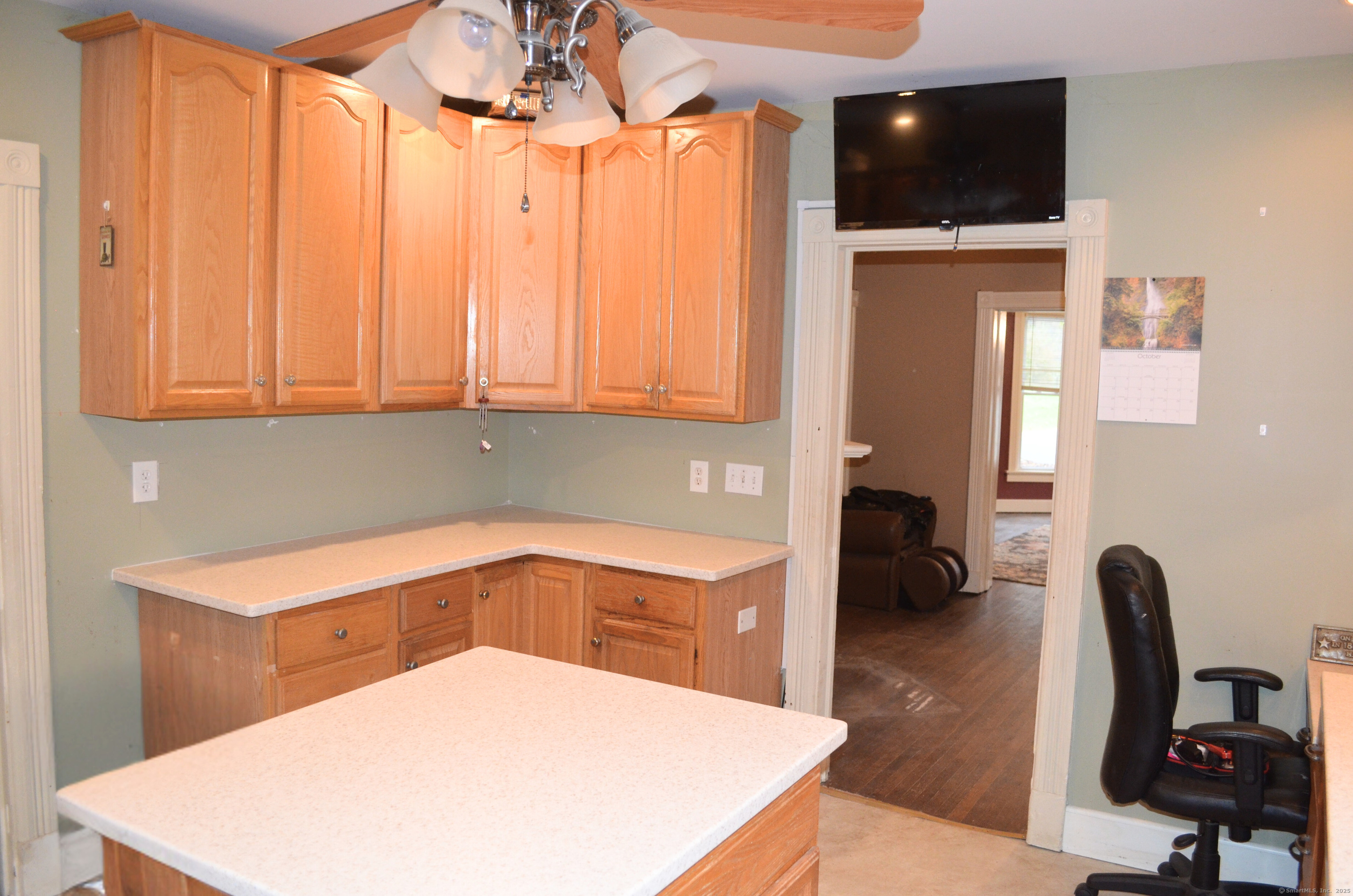 21 Shepard Road Norfolk, CT 06058 - Photo 12 of 17 a kitchen with a sink a microwave and cabinets