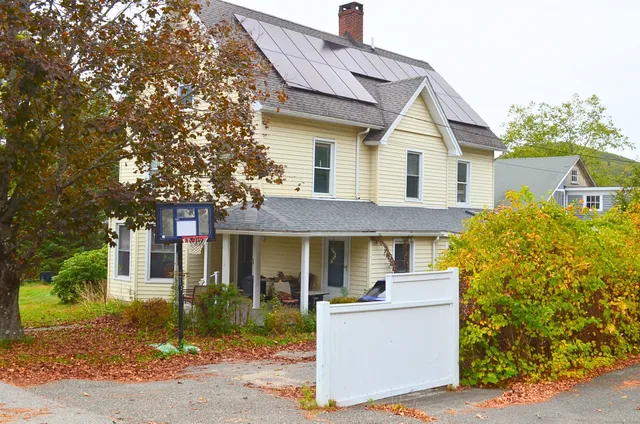 a front view of a house with a porch
