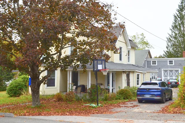 a front view of a house with garden