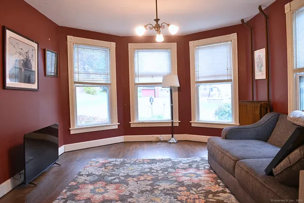 a living room with furniture and a window