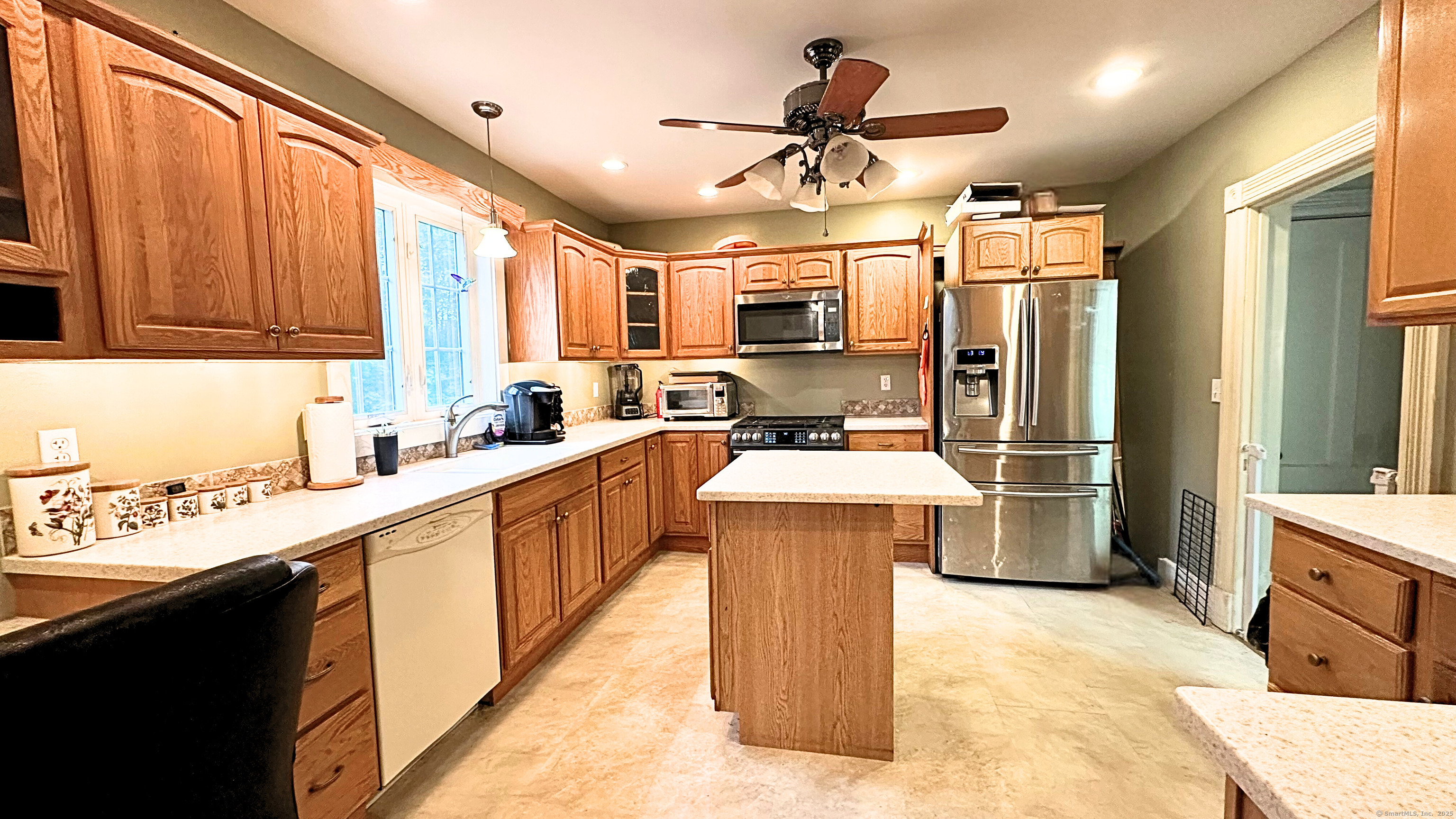 21 Shepard Road Norfolk, CT 06058 - Photo 9 of 17 a kitchen with kitchen island a sink appliances and cabinets