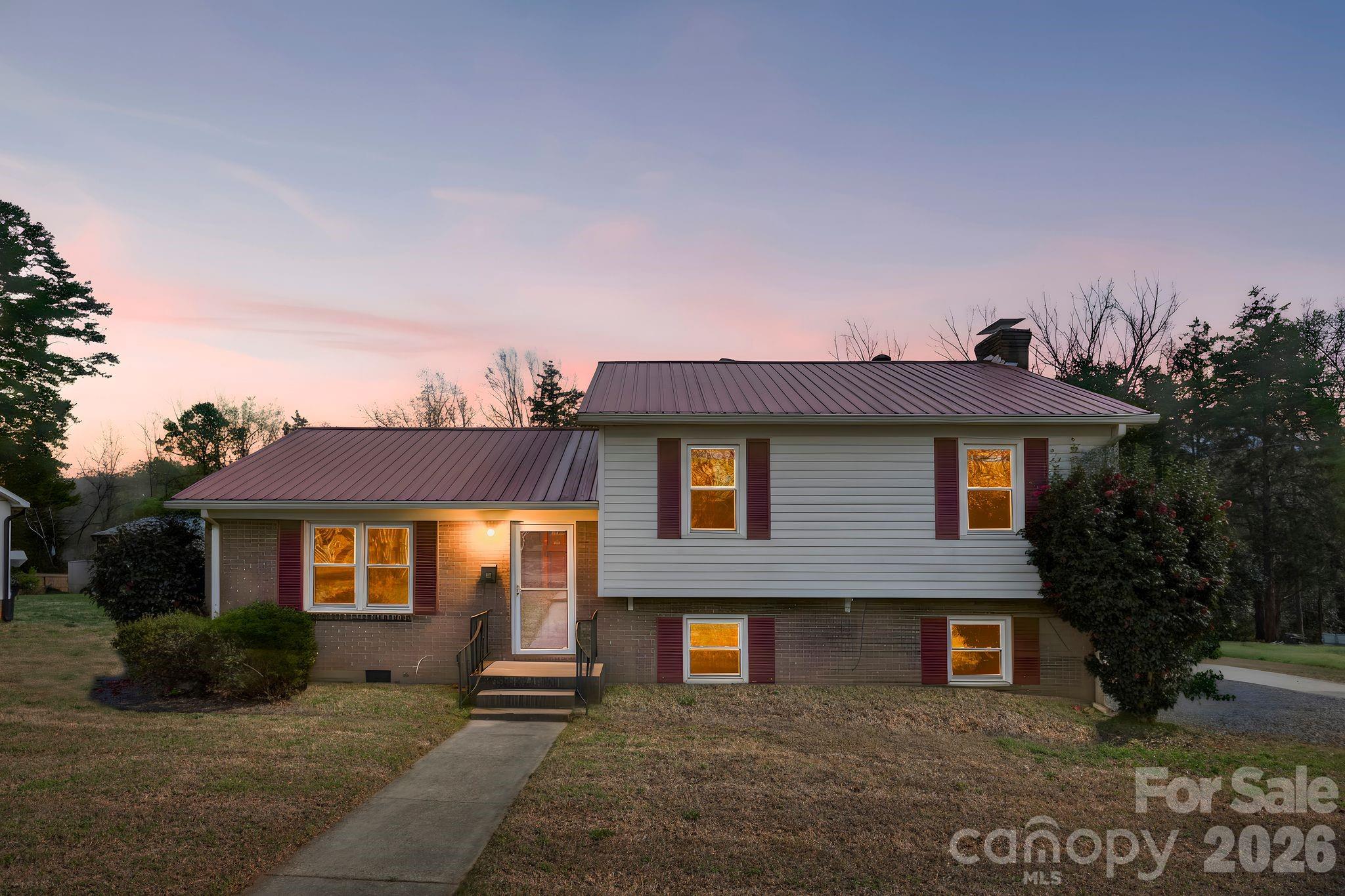 191 Fryling Avenue Southwest Concord, NC 28025 - Photo 1 of 25 a front view of a house with a yard