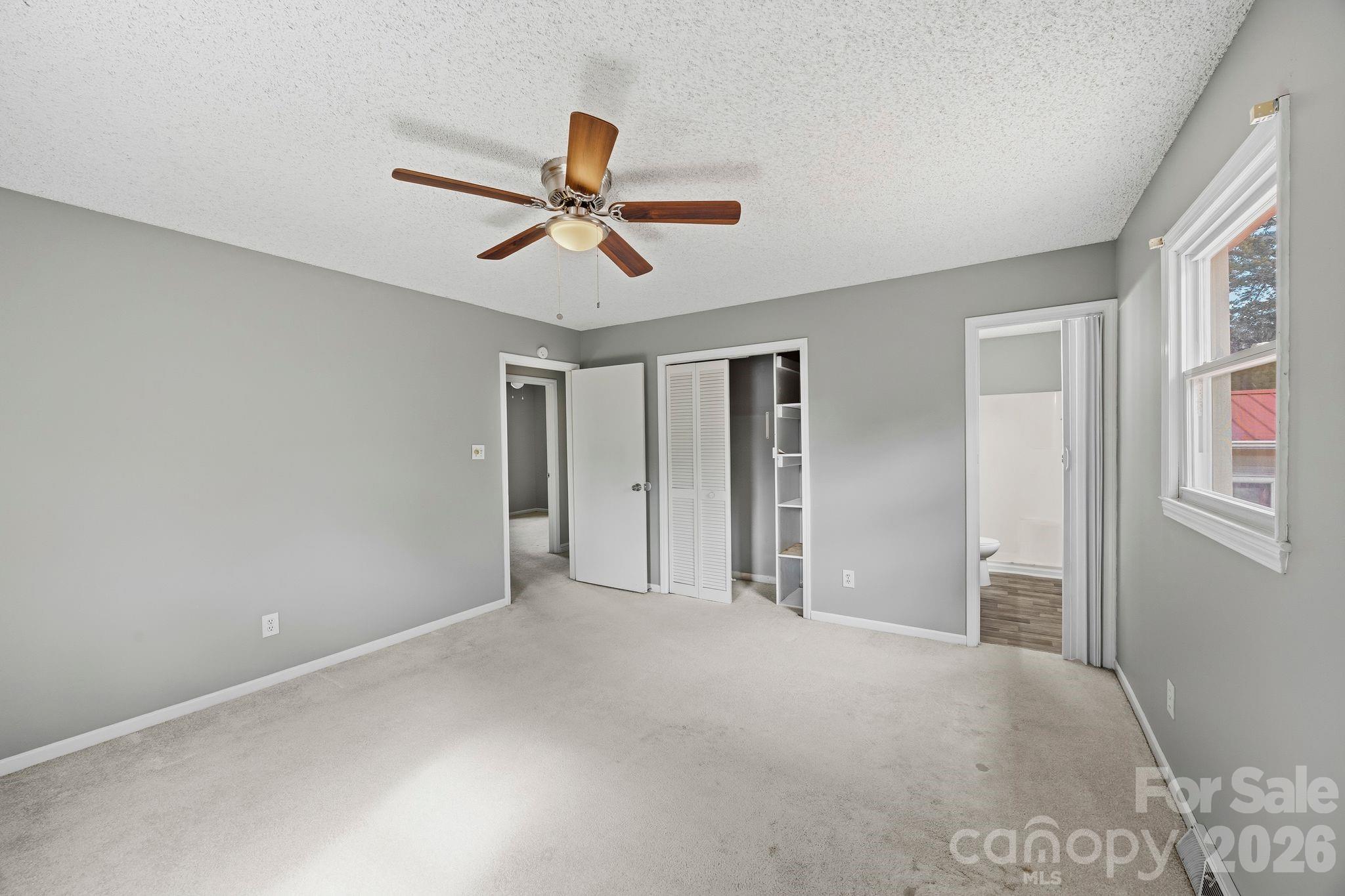 191 Fryling Avenue Southwest Concord, NC 28025 - Photo 17 of 25 a view of a livingroom with a ceiling fan and window
