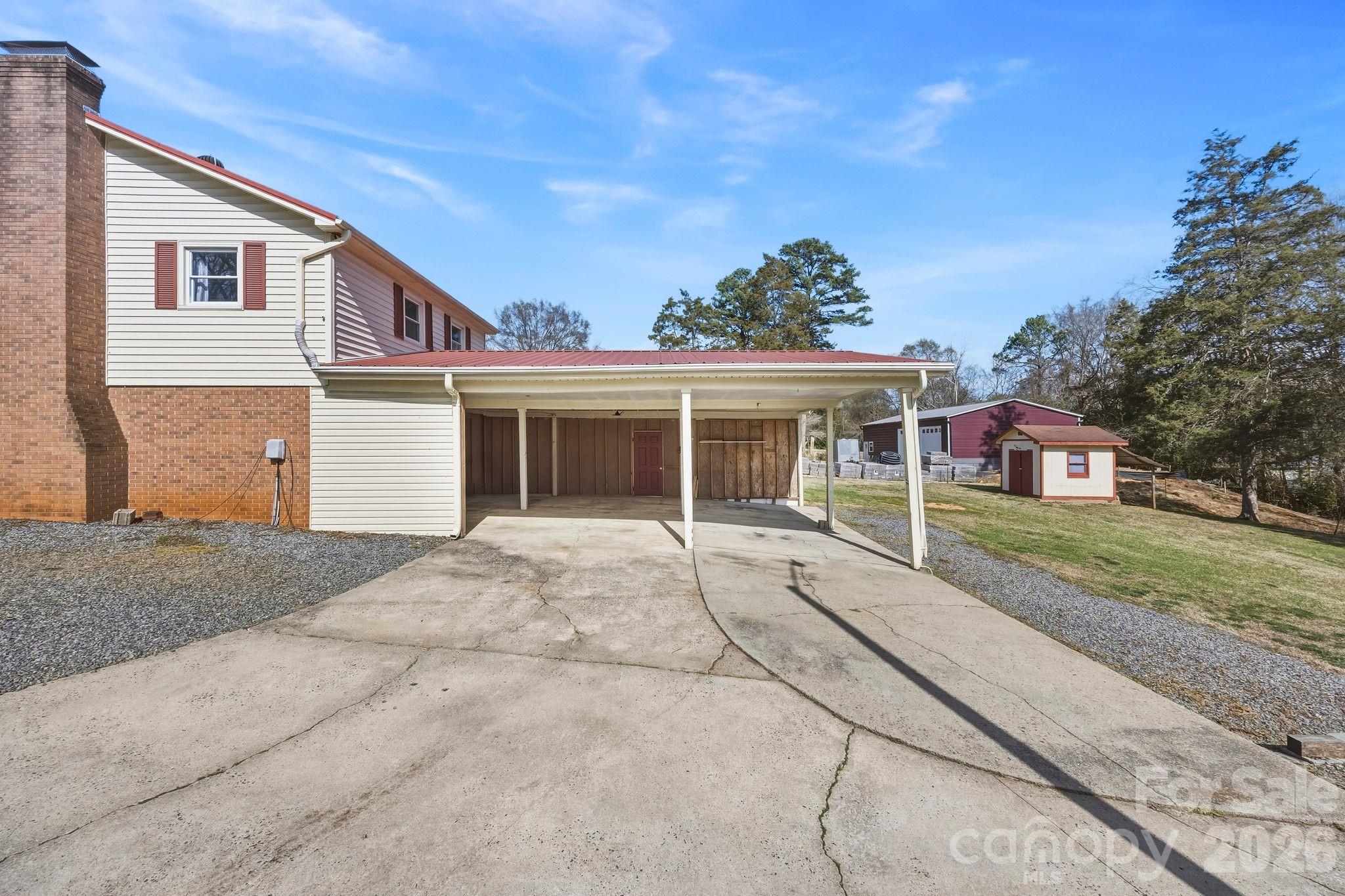 191 Fryling Avenue Southwest Concord, NC 28025 - Photo 24 of 25 a front view of a house with a yard and garage