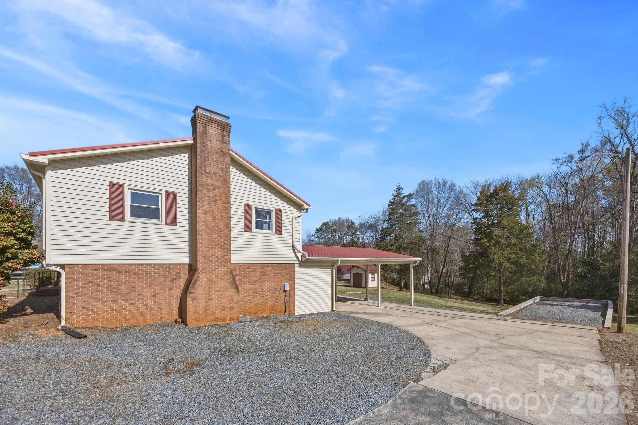 191 Fryling Avenue Southwest Concord, NC 28025 - Photo 25 of 25 a front view of a house with a yard and garage