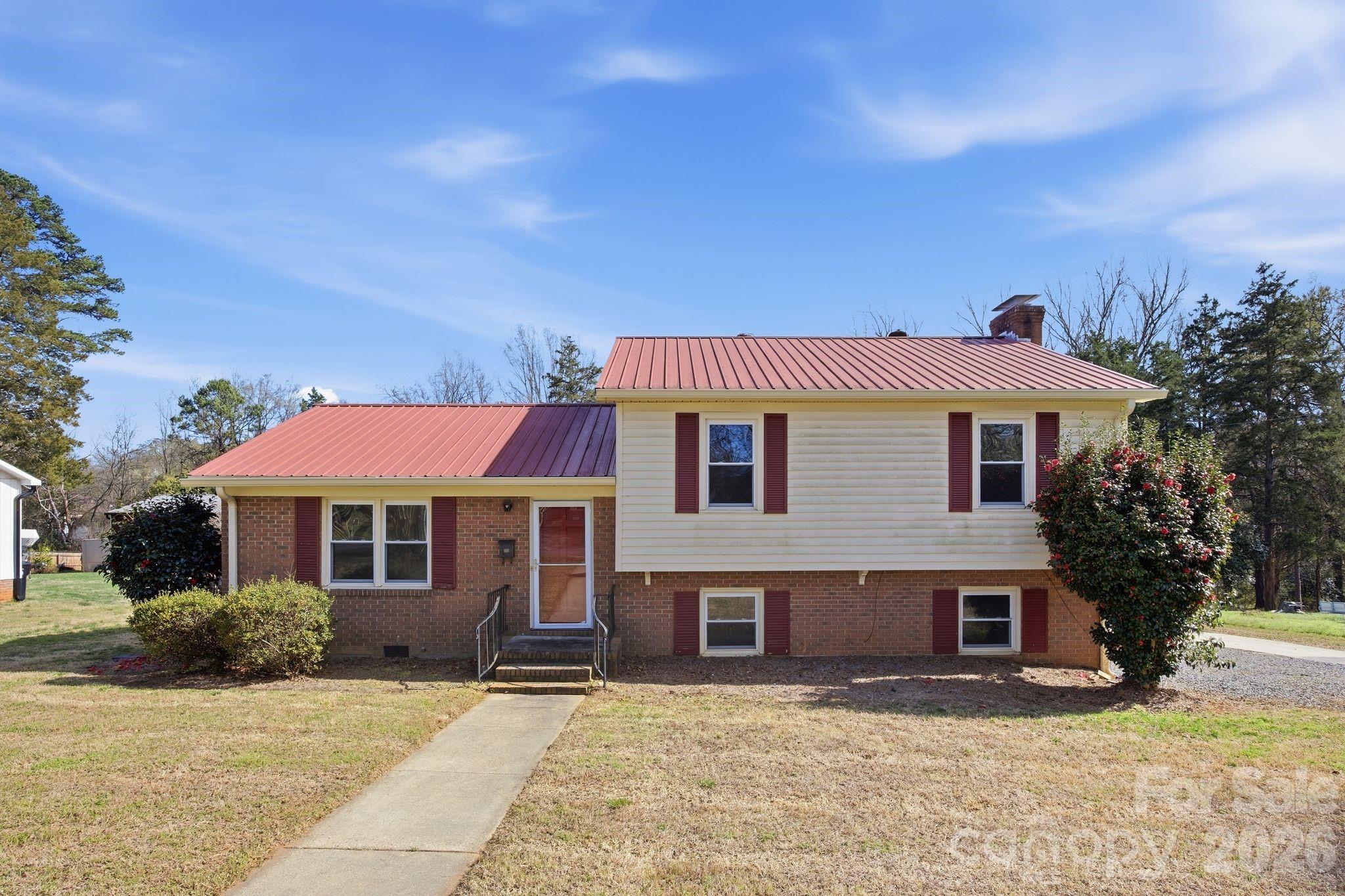 191 Fryling Avenue Southwest Concord, NC 28025 - Photo 3 of 25 a front view of a house with a yard