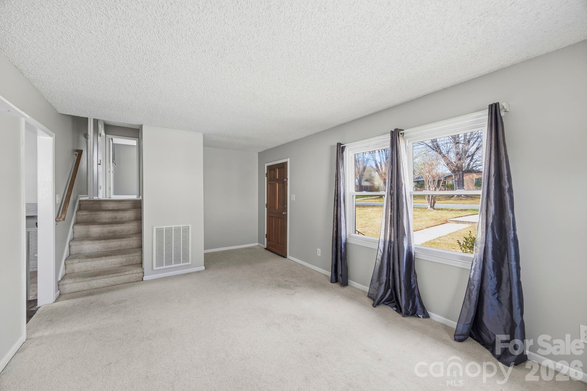 191 Fryling Avenue Southwest Concord, NC 28025 - Photo 5 of 25 a view of an entryway with wooden floor and door