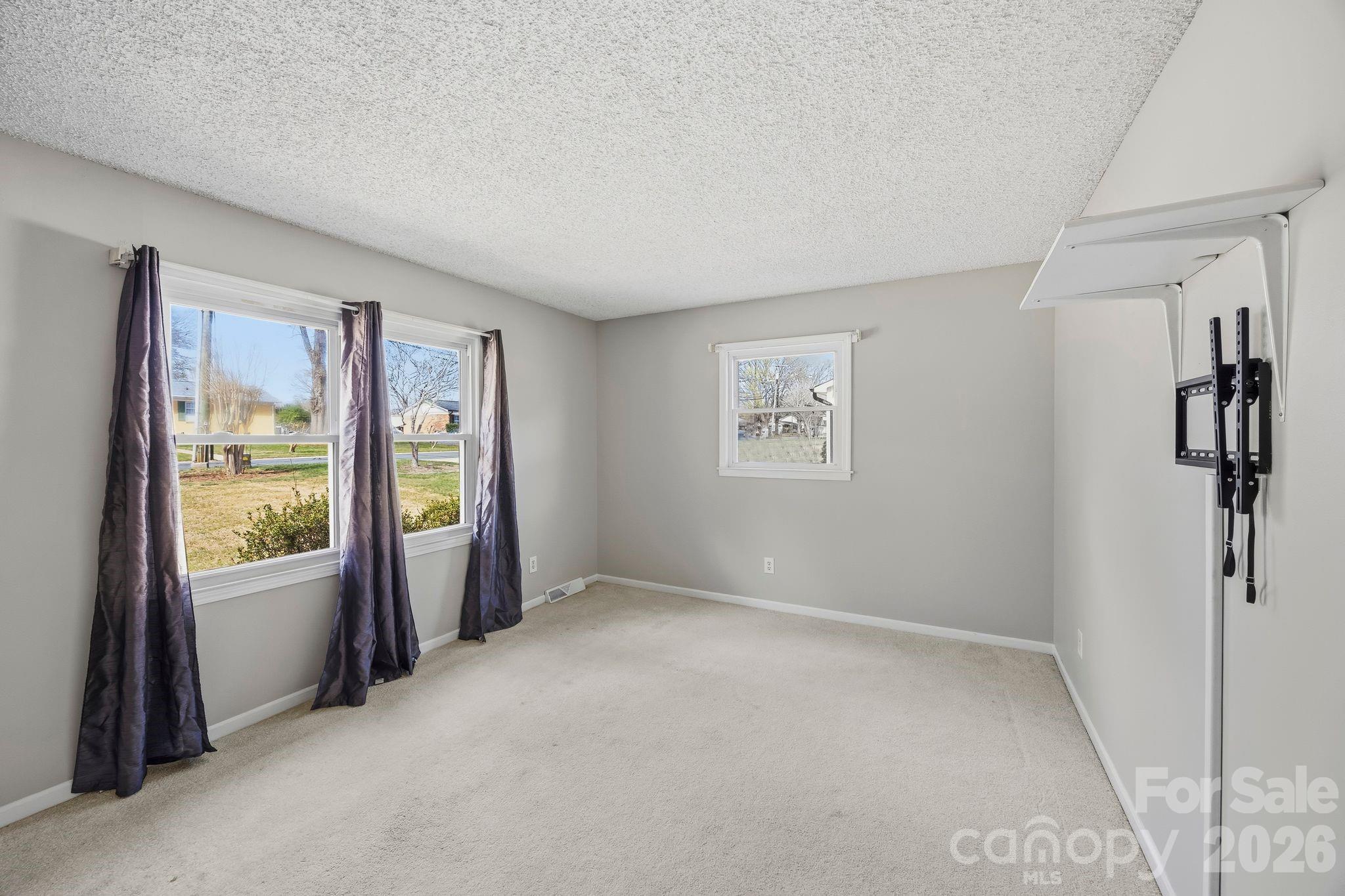 191 Fryling Avenue Southwest Concord, NC 28025 - Photo 6 of 25 a view of an empty room with a window