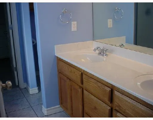 a bathroom with a sink and vanity