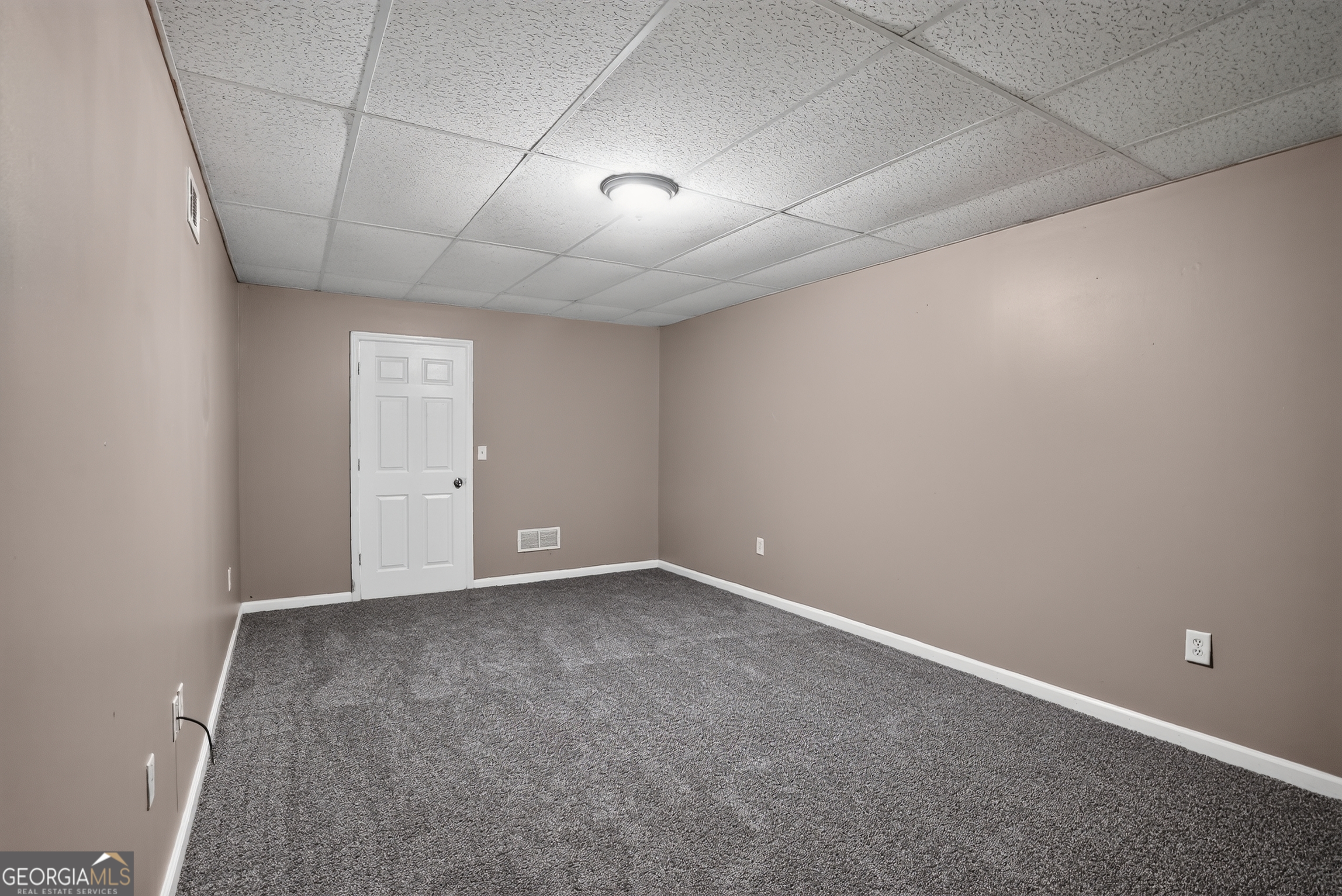 75 Linsley Way Covington, GA 30016 - Photo 46 of 48 an empty room with a empty space and windows