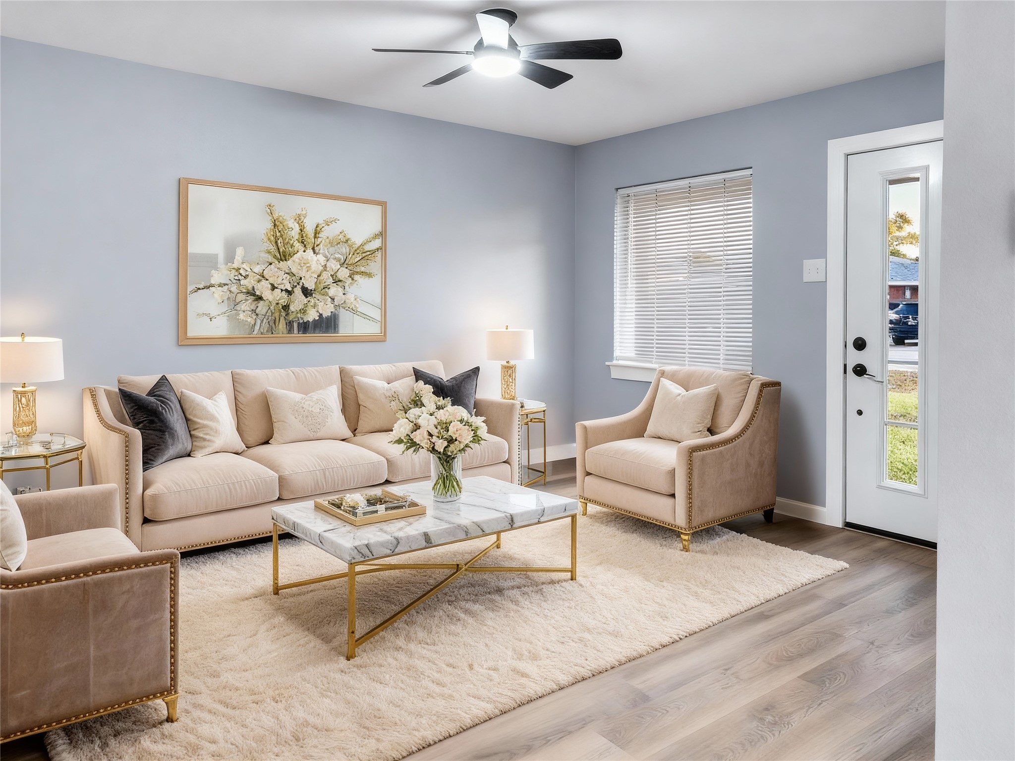 a living room with furniture and a painting on the wall