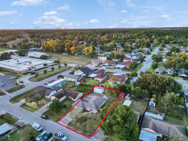 an aerial view of residential houses with outdoor space