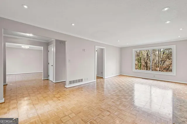 a view of an empty room with a window