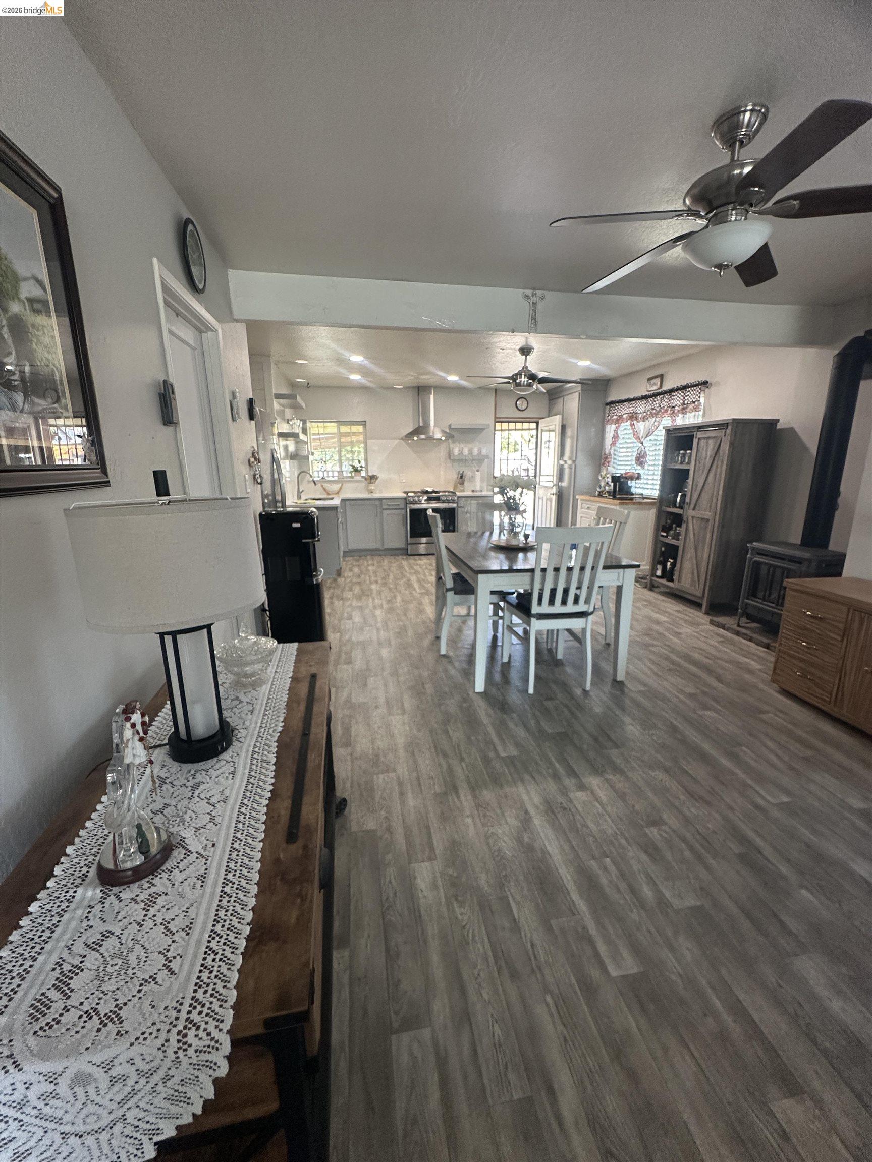 2831 Fabian Road Tracy, CA 95377 - Photo 10 of 23 Open-concept living space with wood-finish flooring, a contemporary ceiling fan, and recessed lighting