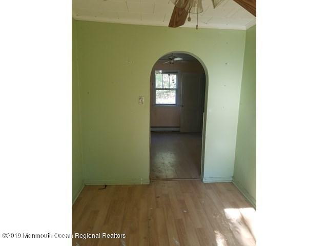 608 Hulses Corner Road Howell, NJ 07731 - Photo 8 of 26 a view of a hallway with wooden floor