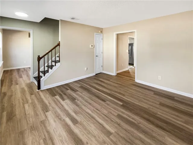 a view of an entryway with wooden floor