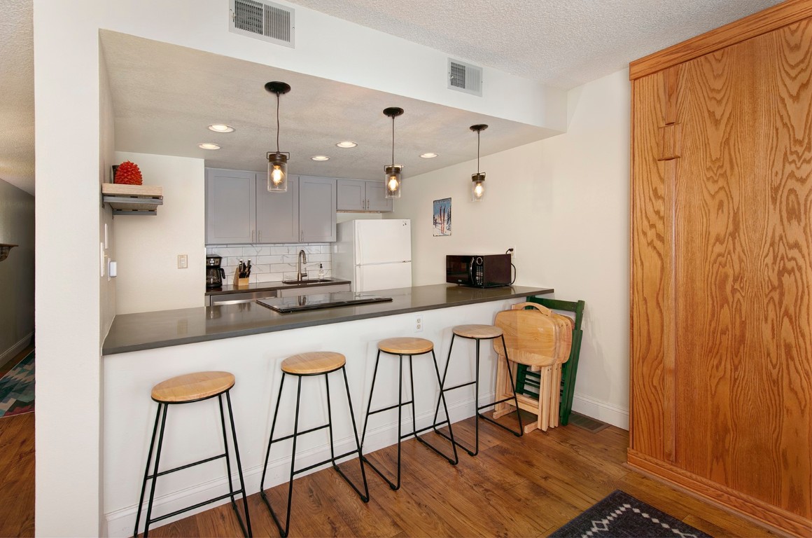 500 Bills Ranch Road, Unit 131 Frisco, CO 80443 - Photo 11 of 35 a kitchen with stainless steel appliances granite countertop a stove a sink and a refrigerator