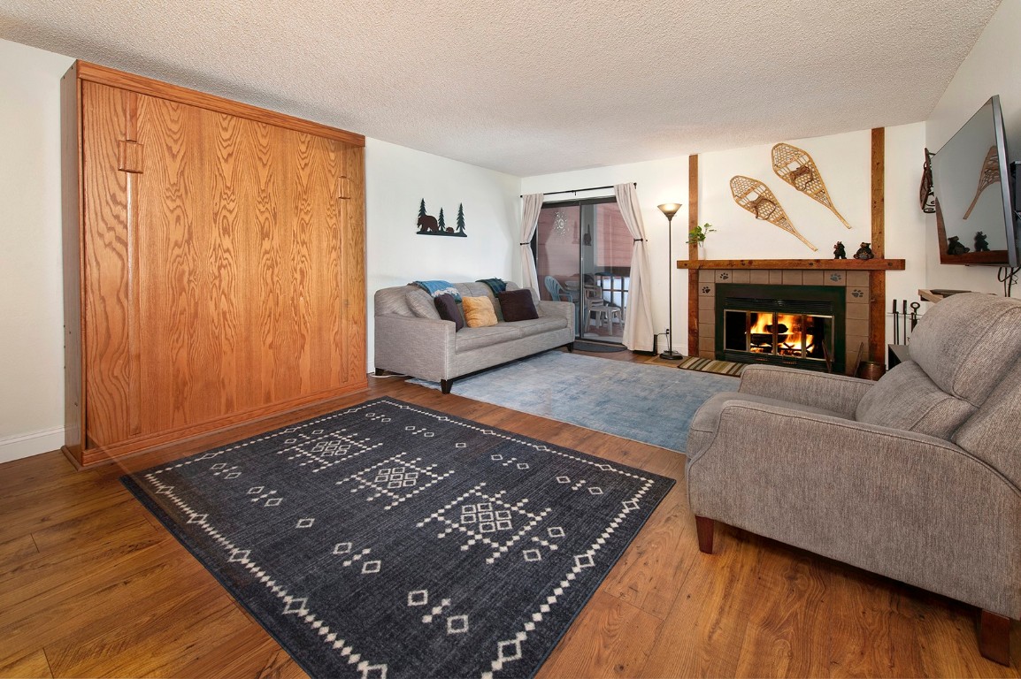 500 Bills Ranch Road, Unit 131 Frisco, CO 80443 - Photo 8 of 35 a living room with furniture and a fireplace