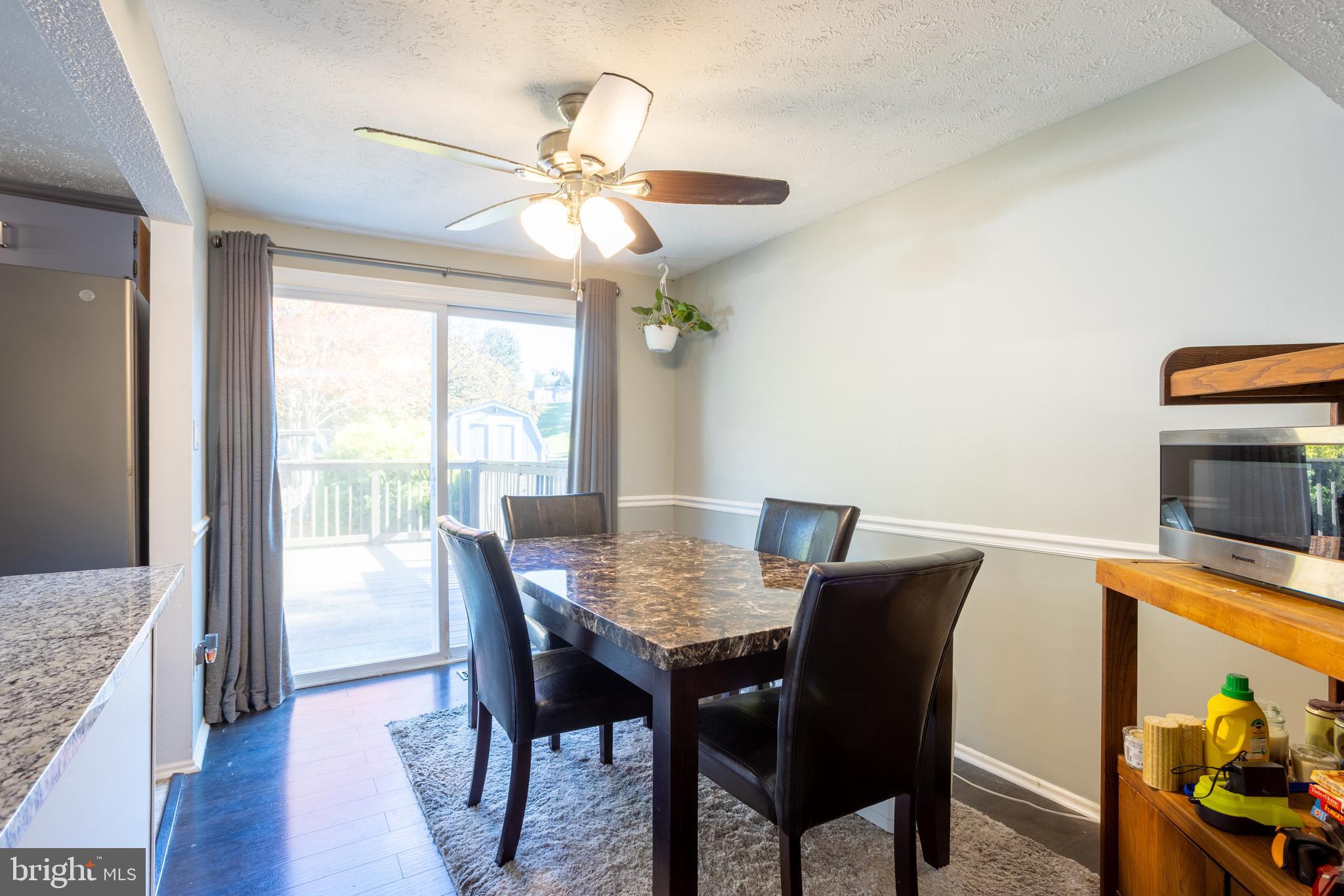 1583 Star Pine Drive Annapolis, MD 21409 - Photo 13 of 37 a view of a dining room with furniture window and wooden floor