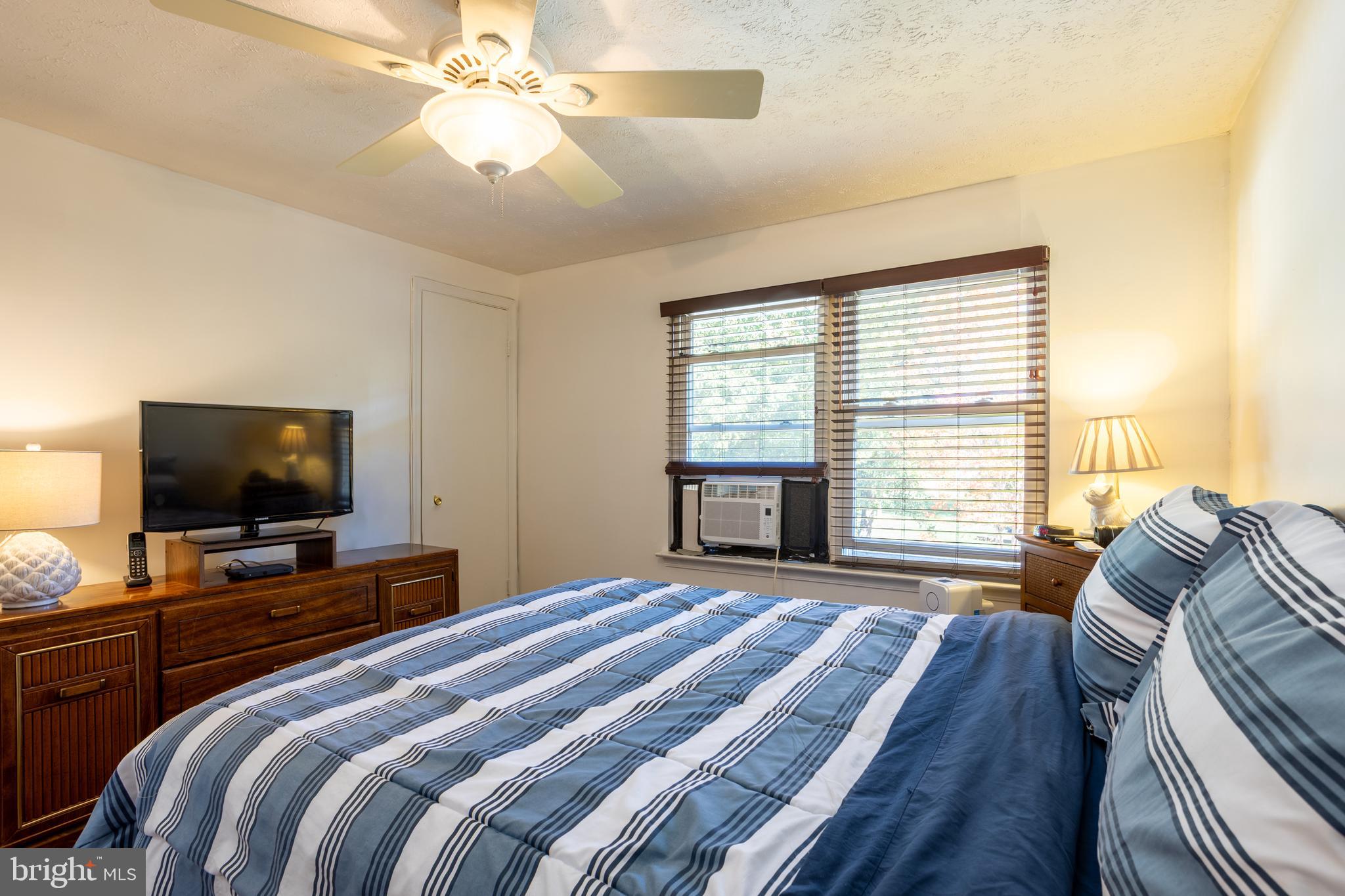 1583 Star Pine Drive Annapolis, MD 21409 - Photo 15 of 37 a bedroom with a bed and a flat screen tv