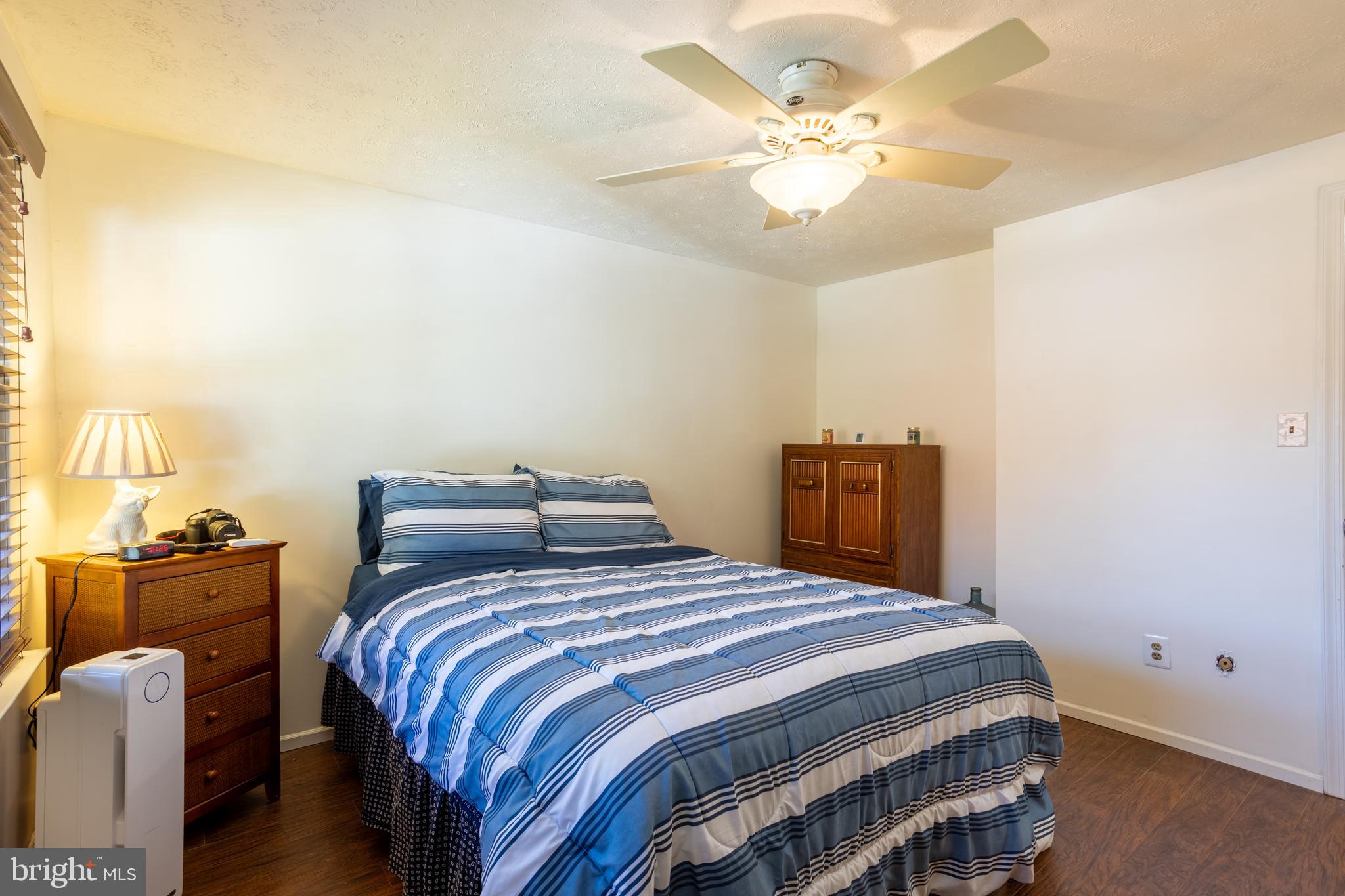 1583 Star Pine Drive Annapolis, MD 21409 - Photo 16 of 37 a bedroom with a bed and a chandelier