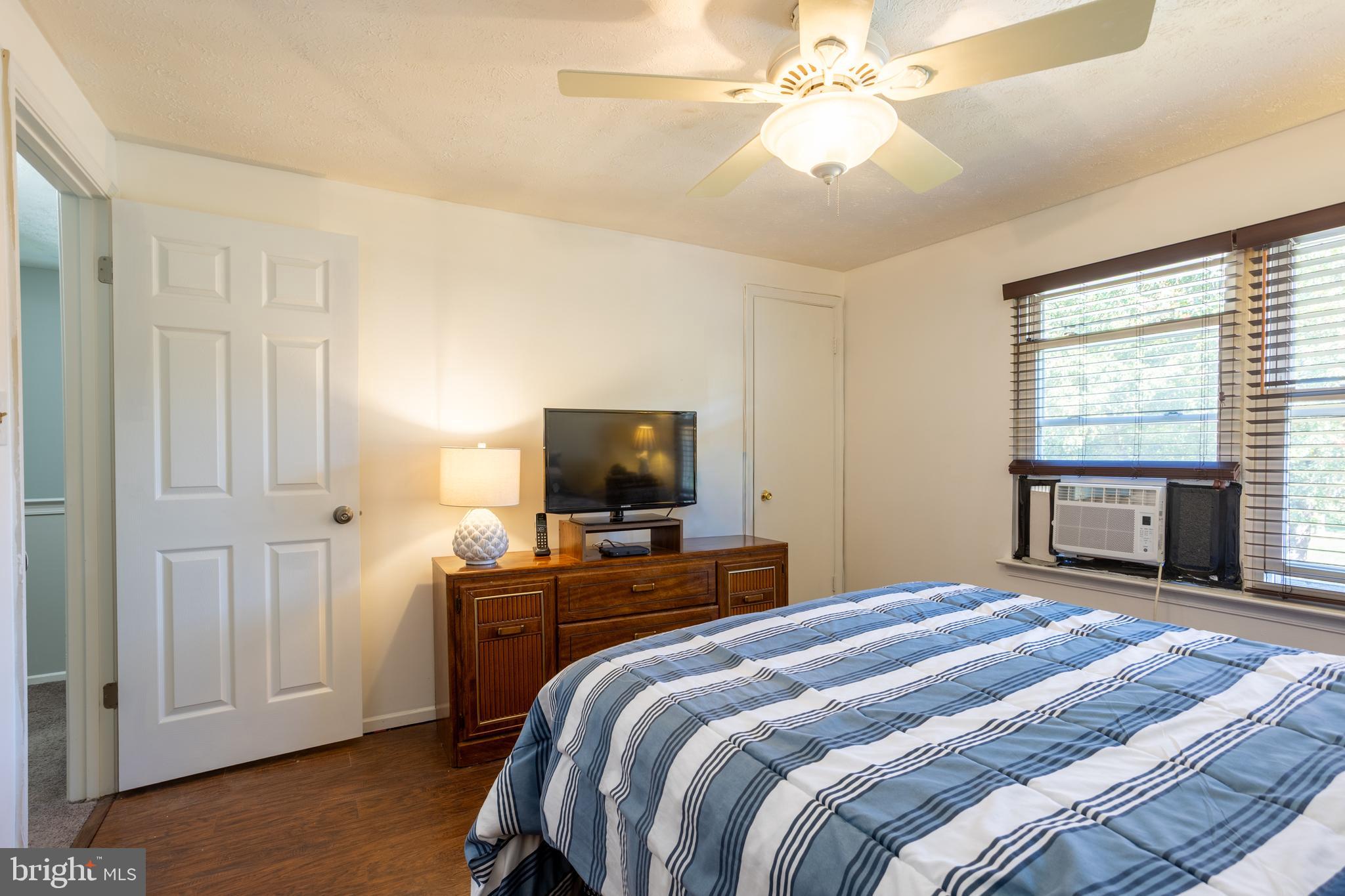 1583 Star Pine Drive Annapolis, MD 21409 - Photo 17 of 37 a bedroom with a bed and a flat screen tv