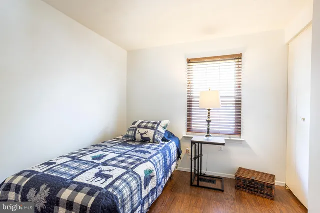 a bedroom with a bed and a closet