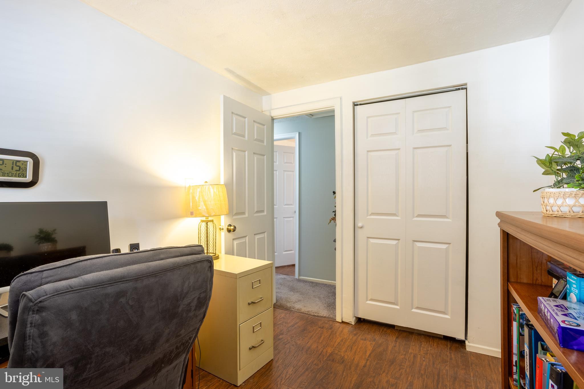 1583 Star Pine Drive Annapolis, MD 21409 - Photo 22 of 37 a bedroom with a bed and wooden floor