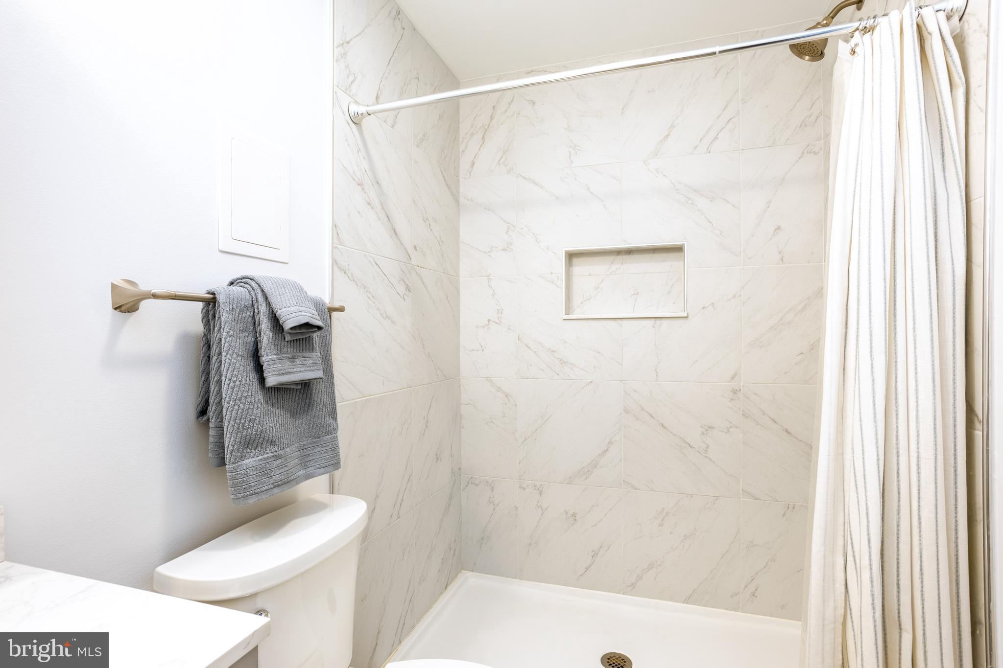 1583 Star Pine Drive Annapolis, MD 21409 - Photo 25 of 37 a bathroom with a shower and a toilet